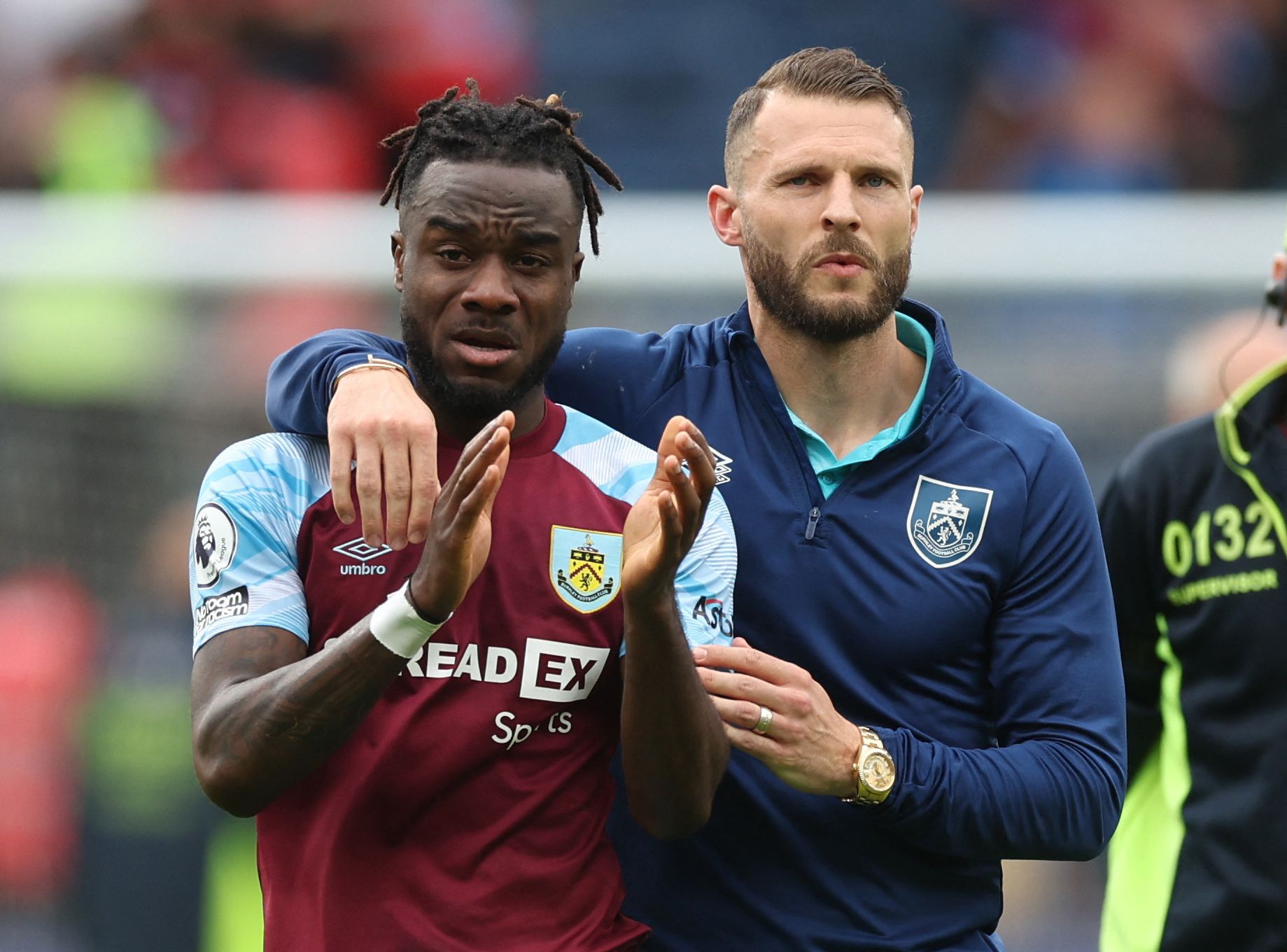 Soccer Football - Premier League - Burnley v Newcastle United - Turf Moor, Burnley, Britain - May 22, 2022 Burnley's Maxwel Cornet and Erik Pieters look dejected after losing the match and being relegated from the Premier League Action Images via Reuters/Lee Smith EDITORIAL USE ONLY. No use with unauthorized audio, video, data, fixture lists, club/league logos or 'live' services. Online in-match use limited to 75 images, no video emulation. No use in betting, games or single club /league/player 