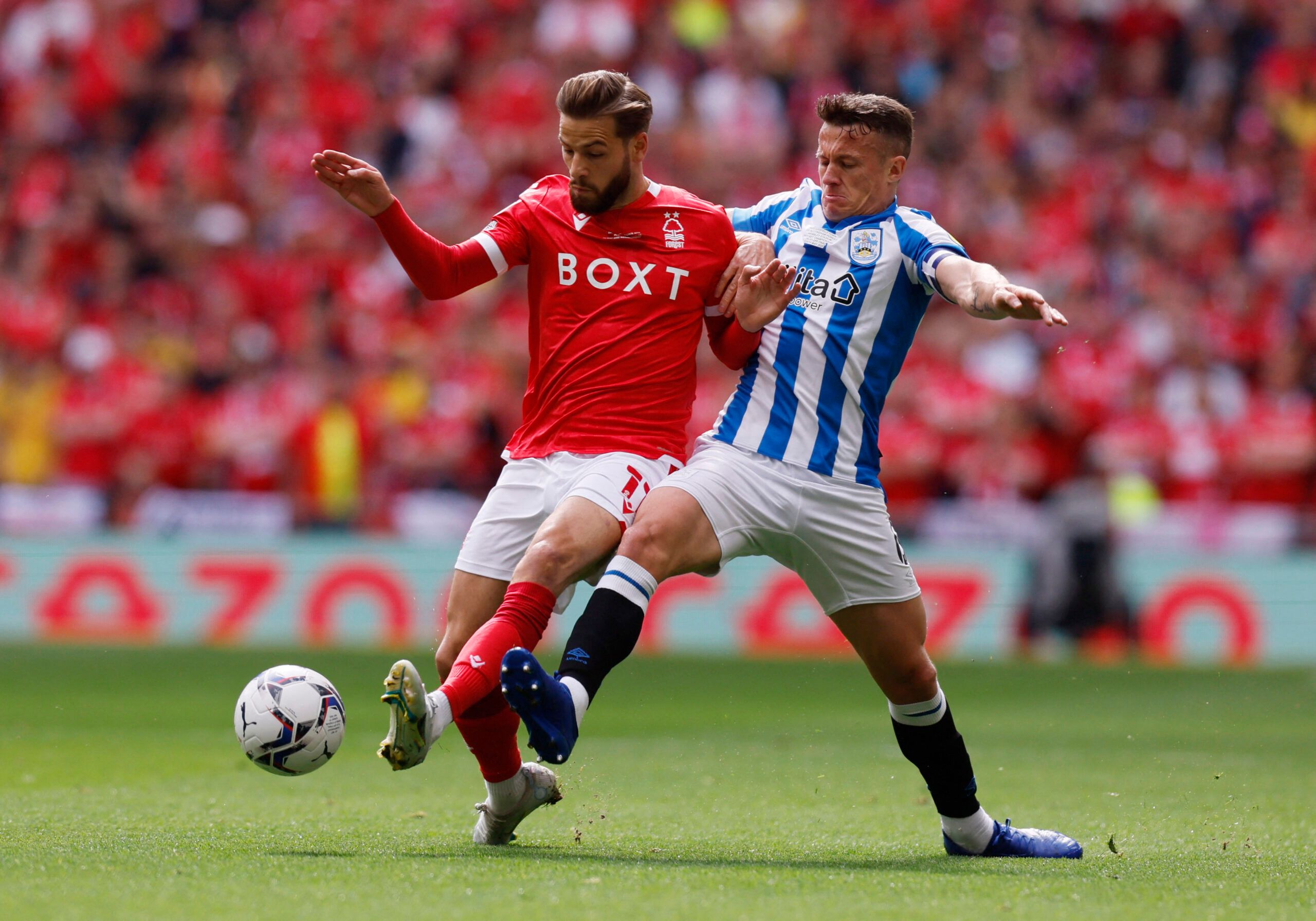 Soccer Football - Championship Play-Off Final - Huddersfield Town v Nottingham Forest - Wembley Stadium, London, Britain - May 29, 2022 Nottingham Forest's Philip Zinckernagel in action with Huddersfield Town's Jonathan Hogg Action Images via Reuters/Andrew Couldridge