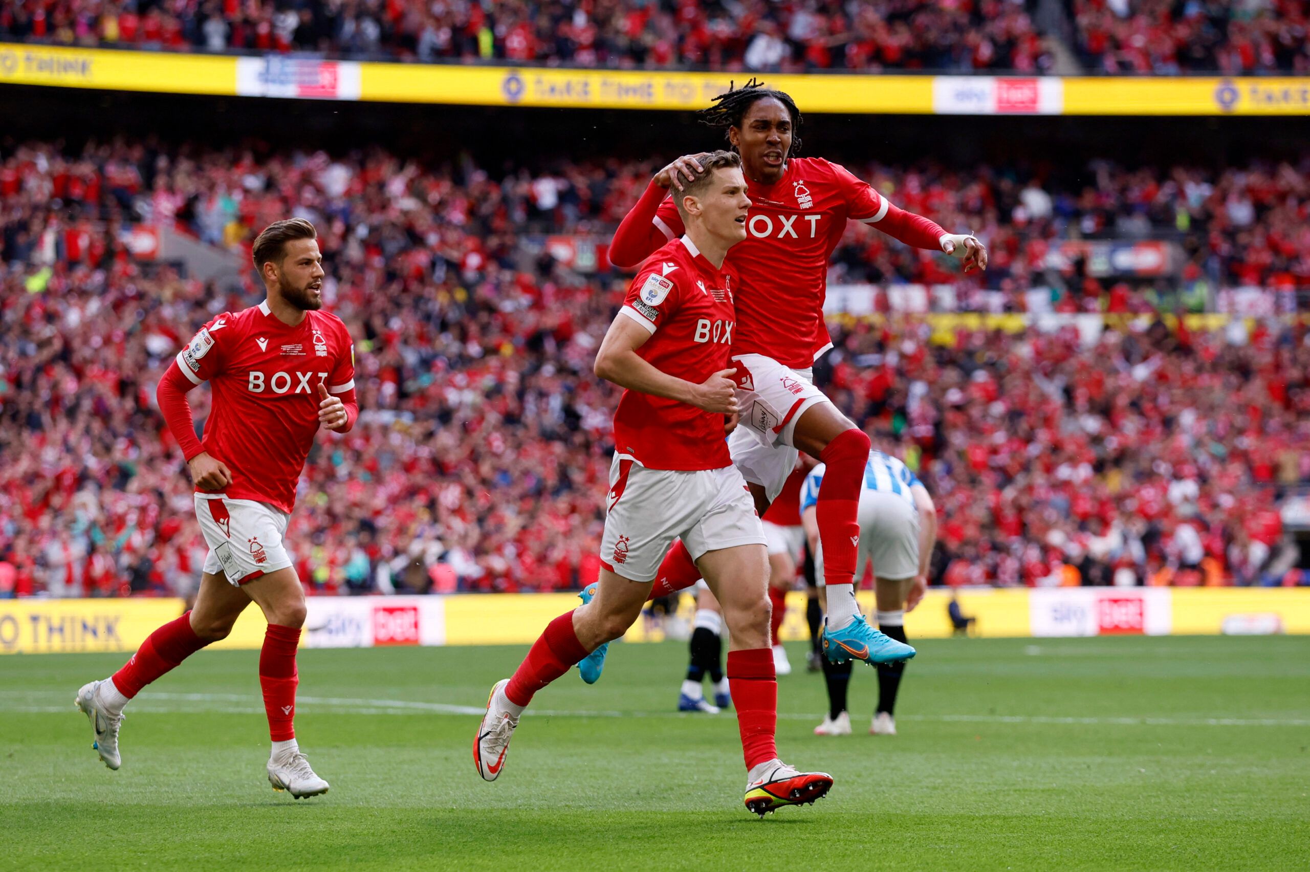 Soccer Football - Championship Play-Off Final - Huddersfield Town v Nottingham Forest - Wembley Stadium, London, Britain - May 29, 2022 Nottingham Forest's Ryan Yates and Djed Spence celebrate after Huddersfield Town's Levi Samuels Colwill scores an own goal and Nottingham Forest's first Action Images via Reuters/Andrew Couldridge