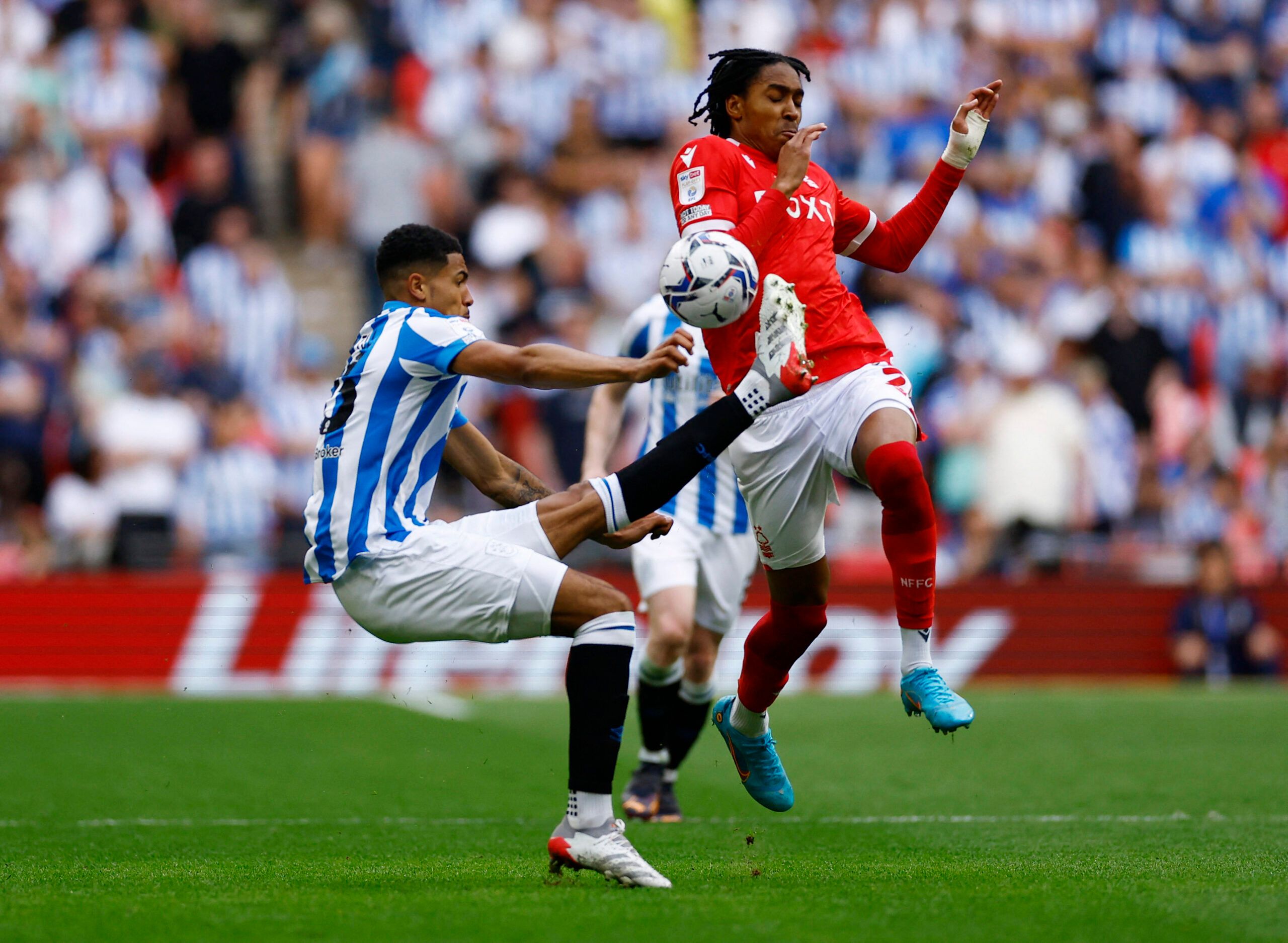 Soccer Football - Championship Play-Off Final - Huddersfield Town v Nottingham Forest - Wembley Stadium, London, Britain - May 29, 2022 Huddersfield Town's Levi Samuels Colwill in action with Nottingham Forest's Djed Spence Action Images via Reuters/Andrew Boyers