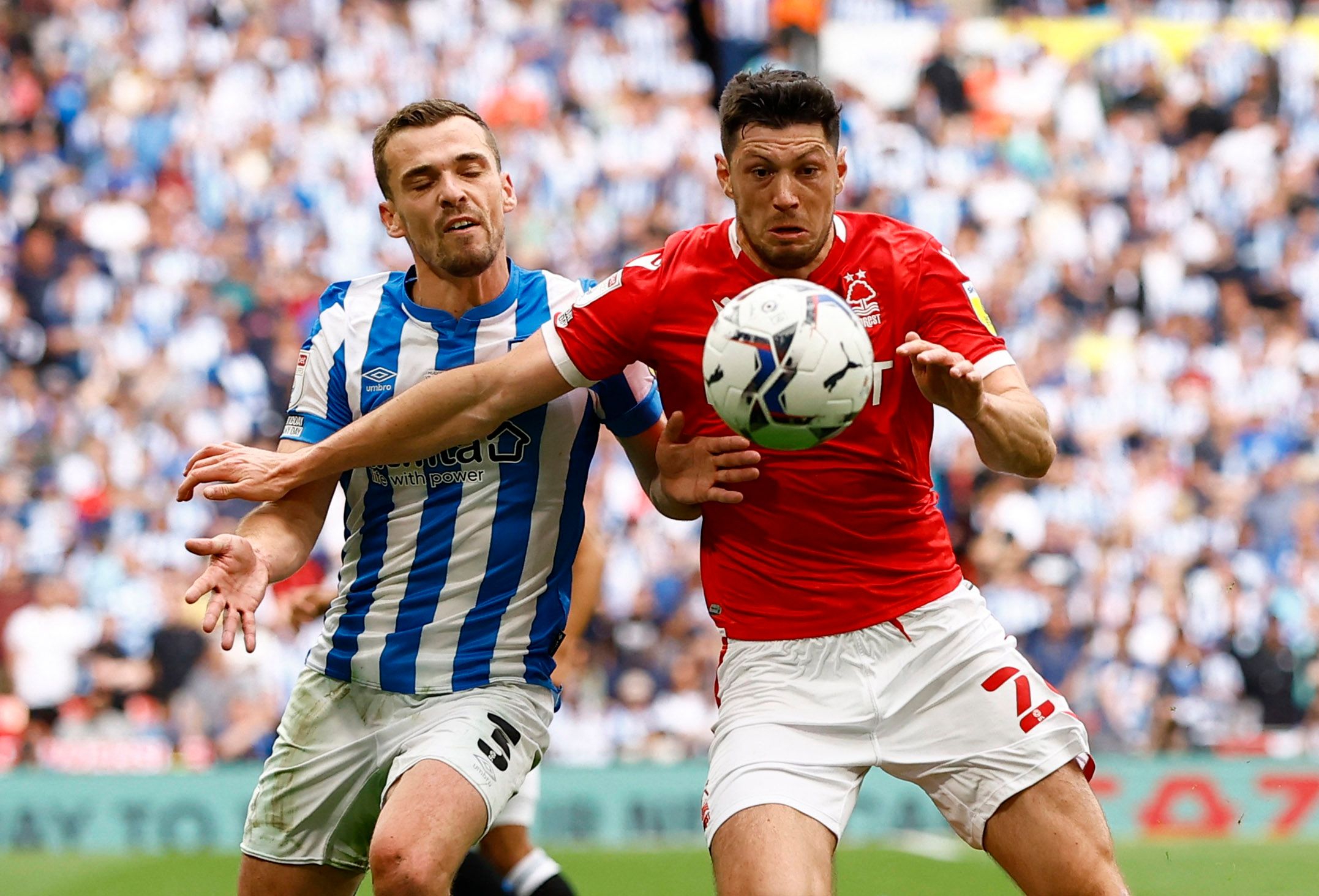 Soccer Football - Championship Play-Off Final - Huddersfield Town v Nottingham Forest - Wembley Stadium, London, Britain - May 29, 2022 Huddersfield Town's Harry Toffolo in action with Nottingham Forest's Scott McKenna Action Images via Reuters/Andrew Boyers