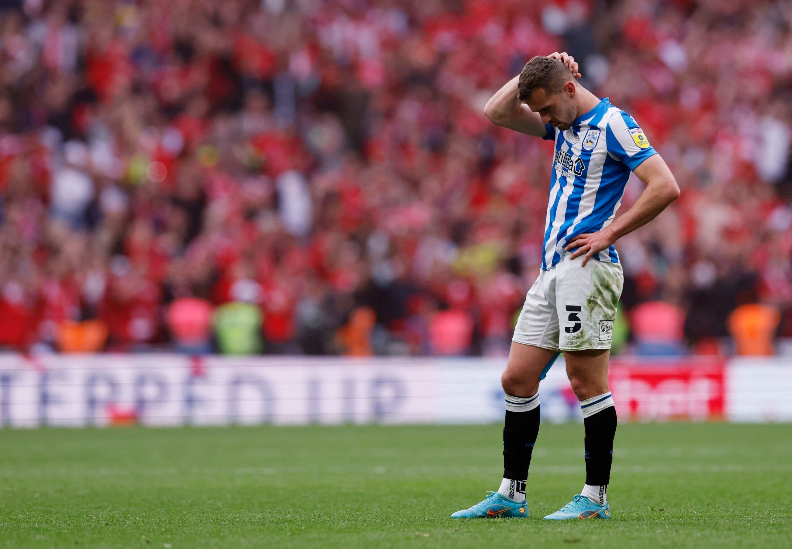 Soccer Football - Championship Play-Off Final - Huddersfield Town v Nottingham Forest - Wembley Stadium, London, Britain - May 29, 2022 Huddersfield Town's Harry Toffolo looks dejected after the match Action Images via Reuters/Andrew Couldridge