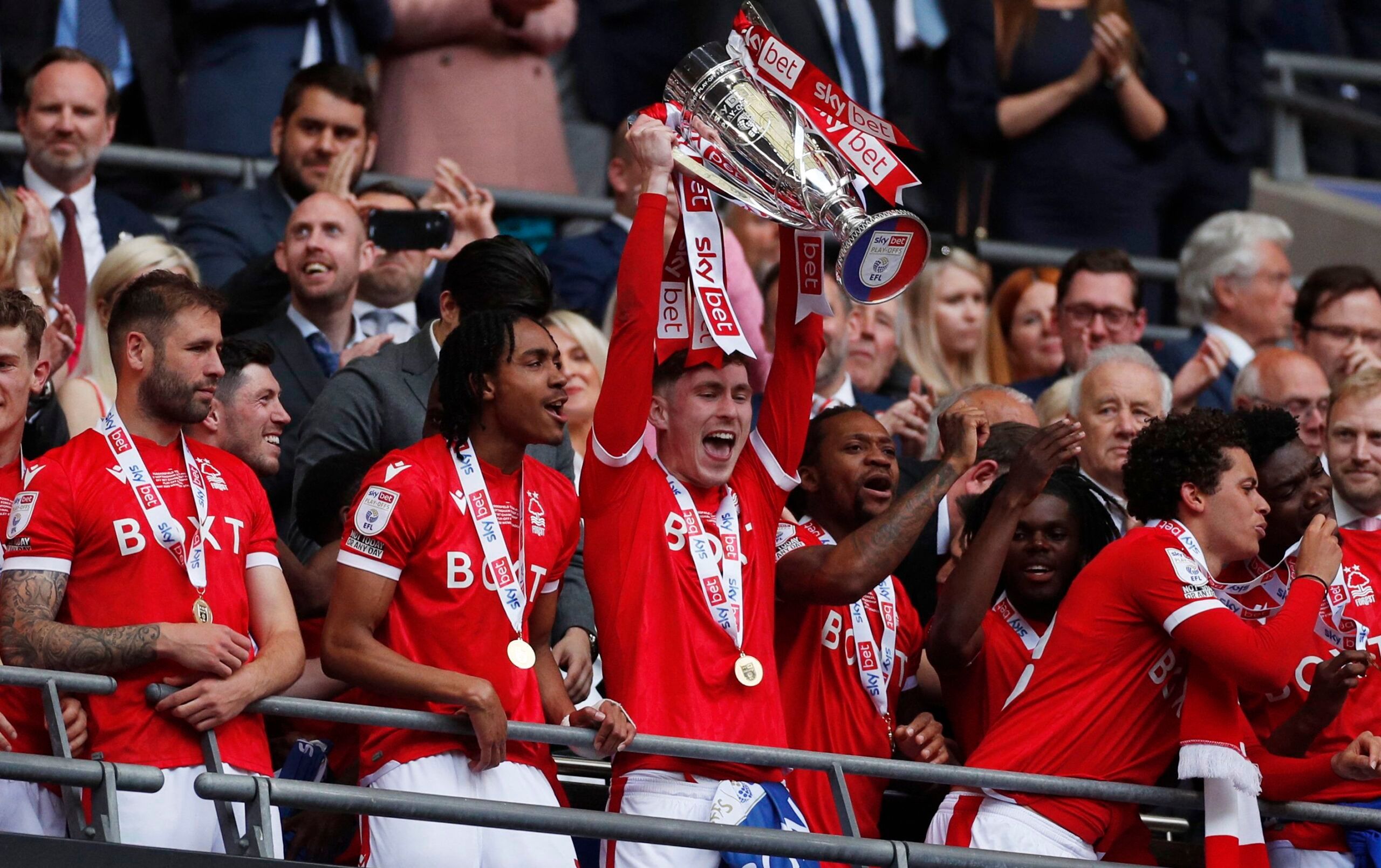 Soccer Football - Championship Play-Off Final - Huddersfield Town v Nottingham Forest - Wembley Stadium, London, Britain - May 29, 2022 Nottingham Forest's James Garner celebrates with the trophy after winning the Championship Play-Off Final Action Images via Reuters/Andrew Boyers