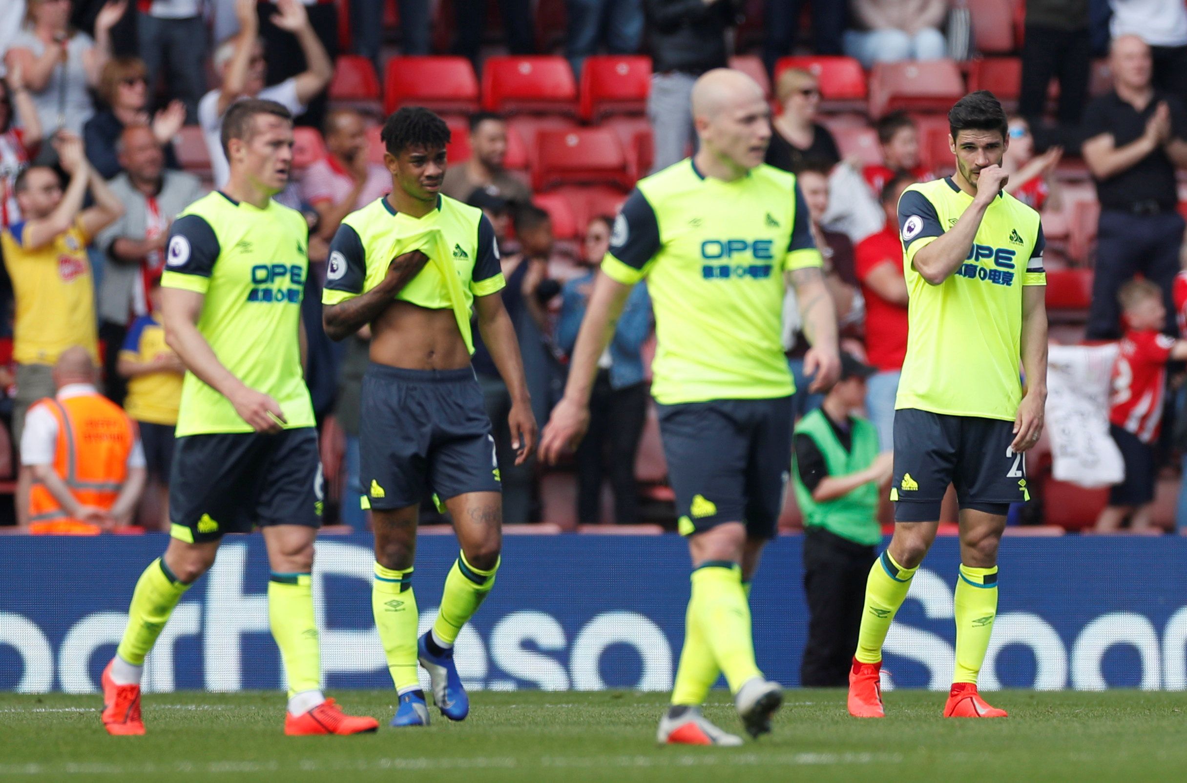 Soccer Football - Premier League - Southampton v Huddersfield Town - St Mary's Stadium, Southampton, Britain - May 12, 2019  Huddersfield Town's Christopher Schindler and team mates look dejected after Southampton's Nathan Redmond scores their first goal       Action Images via Reuters/Paul Childs  EDITORIAL USE ONLY. No use with unauthorized audio, video, data, fixture lists, club/league logos or 