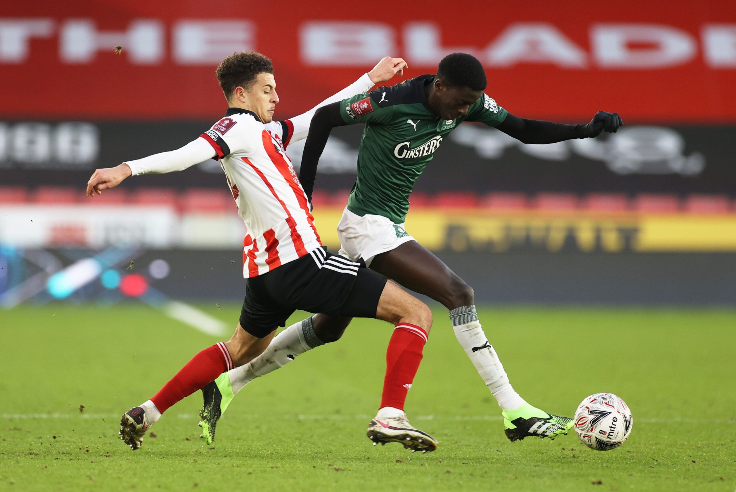 Soccer Football - FA Cup - Fourth Round - Sheffield United v Plymouth Argyle - Bramall Lane, Sheffield, Britain - January 23, 2021 Plymouth Argyle's Panutche Camara in action with Sheffield United's Ethan Ampadu Action Images via Reuters/Lee Smith