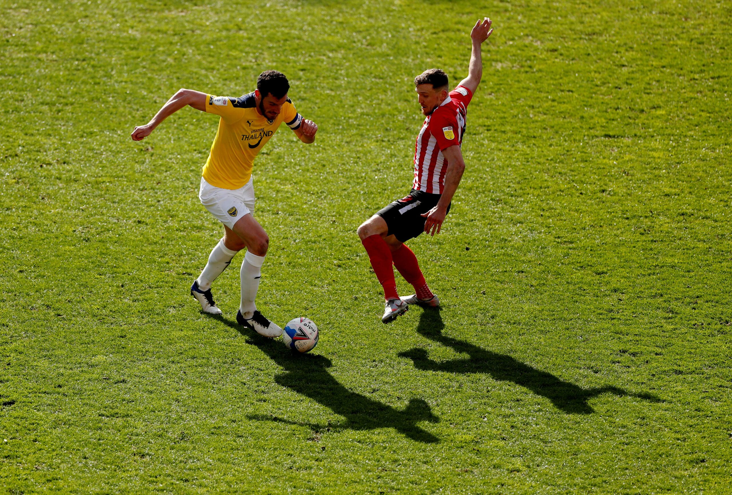 Soccer Football - League One - Sunderland v Oxford United - Stadium of Light, Sunderland, Britain - April 2, 2021   Sunderland's Charlie Wyke in action with Oxford United's Elliott Moore     Action Images/Lee Smith    EDITORIAL USE ONLY. No use with unauthorized audio, video, data, fixture lists, club/league logos or 