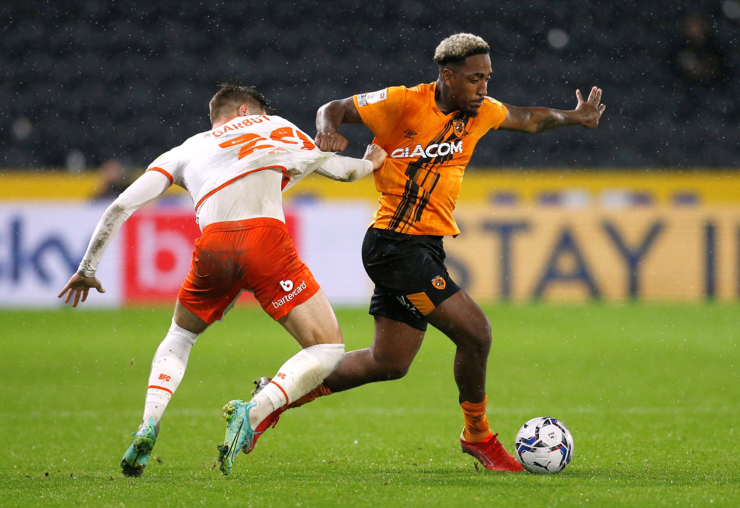 Soccer Football - Championship - Hull City v Blackpool - KCOM Stadium, Hull, Britain - September 28, 2021  Hull City's Mallik Wilks in action with Blackpool's Luke Garbutt  Action Images/Ed Sykes  EDITORIAL USE ONLY. No use with unauthorized audio, video, data, fixture lists, club/league logos or 