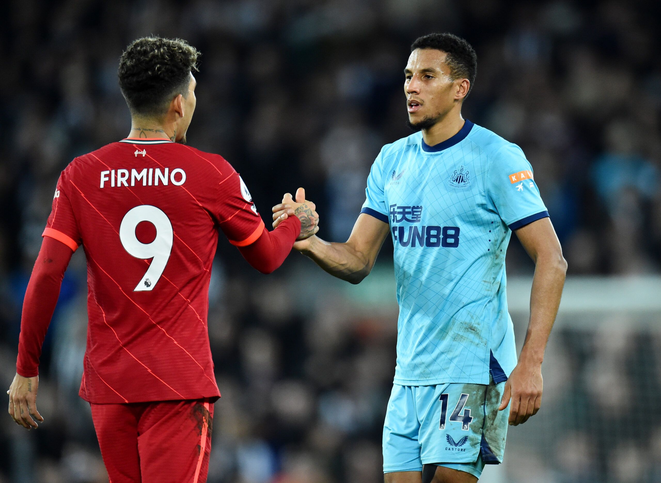 Soccer Football - Premier League - Liverpool v Newcastle United - Anfield, Liverpool, Britain - December 16, 2021 Liverpool's Roberto Firmino shakes hands with Newcastle United's Isaac Hayden after the match REUTERS/Peter Powell EDITORIAL USE ONLY. No use with unauthorized audio, video, data, fixture lists, club/league logos or 'live' services. Online in-match use limited to 75 images, no video emulation. No use in betting, games or single club /league/player publications.  Please contact your a