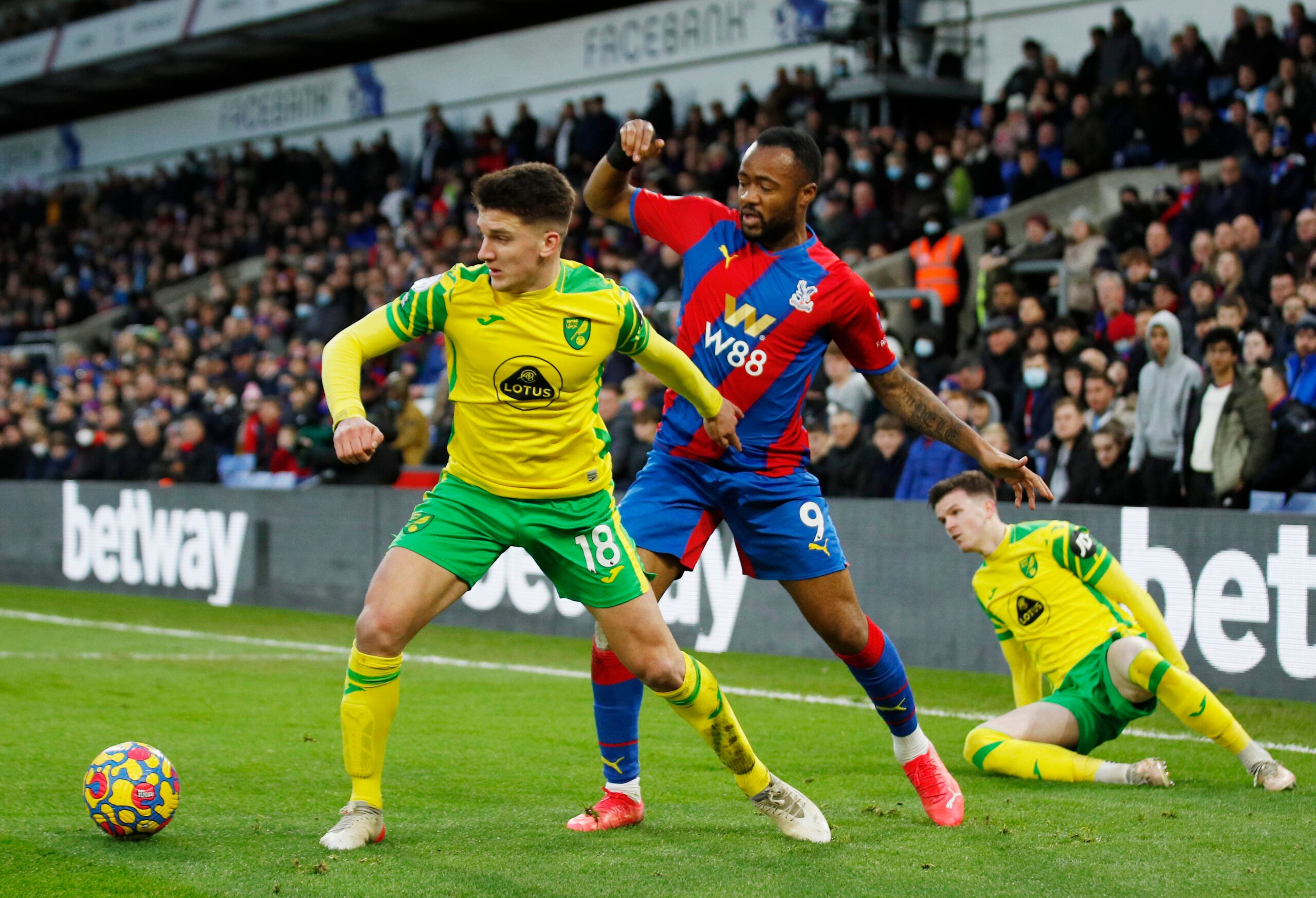 Soccer Football - Premier League - Crystal Palace v Norwich City - Selhurst Park, London, Britain - December 28, 2021 Norwich City's Christos Tzolis in action with Crystal Palace's Jordan Ayew Action Images via Reuters/Andrew Boyers EDITORIAL USE ONLY. No use with unauthorized audio, video, data, fixture lists, club/league logos or 'live' services. Online in-match use limited to 75 images, no video emulation. No use in betting, games or single club /league/player publications.  Please contact yo