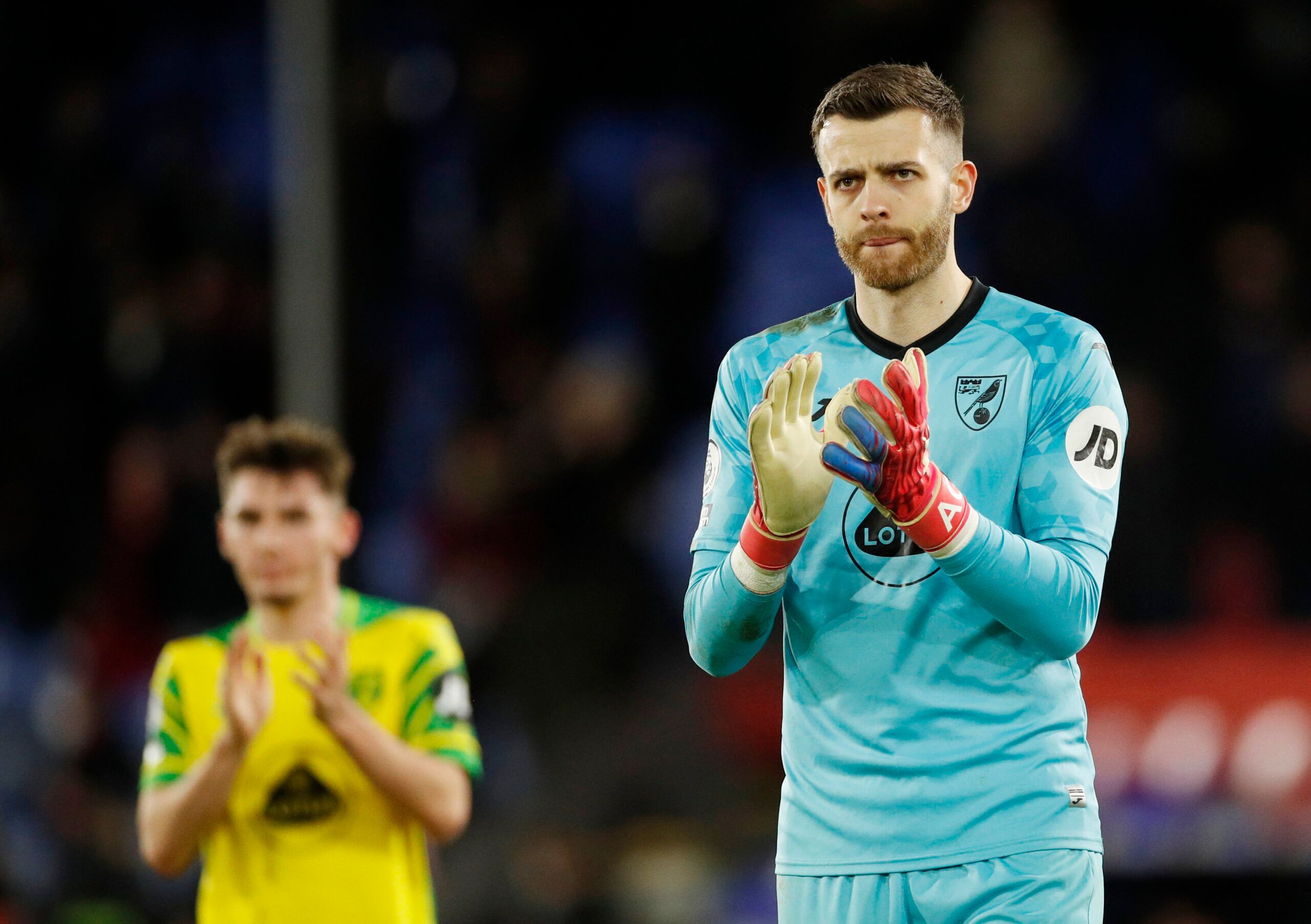 Soccer Football - Premier League - Crystal Palace v Norwich City - Selhurst Park, London, Britain - December 28, 2021 Norwich City's Angus Gunn applauds the fans after the match Action Images via Reuters/Andrew Boyers EDITORIAL USE ONLY. No use with unauthorized audio, video, data, fixture lists, club/league logos or 'live' services. Online in-match use limited to 75 images, no video emulation. No use in betting, games or single club /league/player publications.  Please contact your account repr