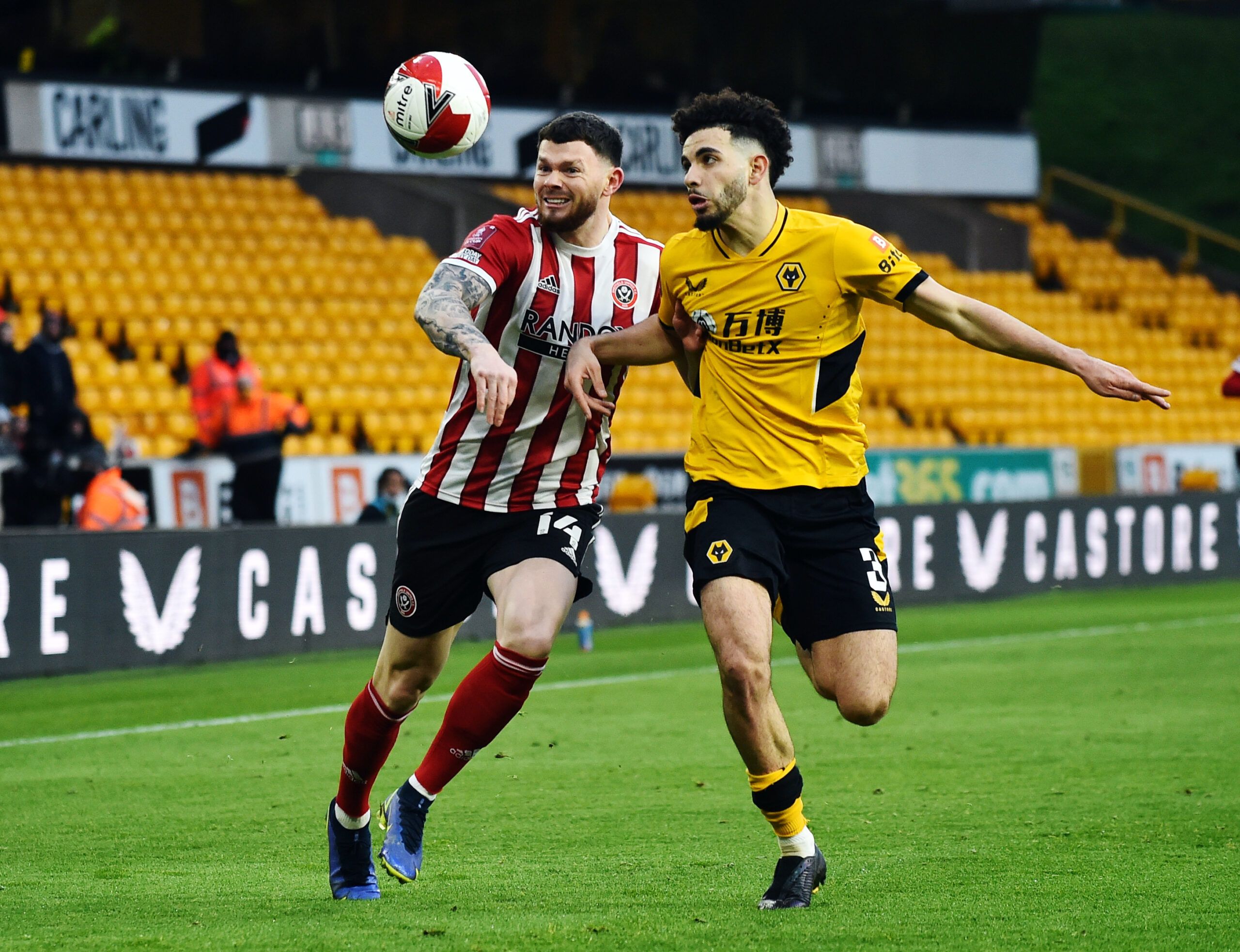 Soccer Football - FA Cup Third Round - Wolverhampton Wanderers v Sheffield United - Molineux Stadium, Wolverhampton, Britain - January 9, 2022 Sheffield United's Oliver Burke in action with Wolverhampton Wanderers' Rayan Ait-Nouri REUTERS/Peter Powell