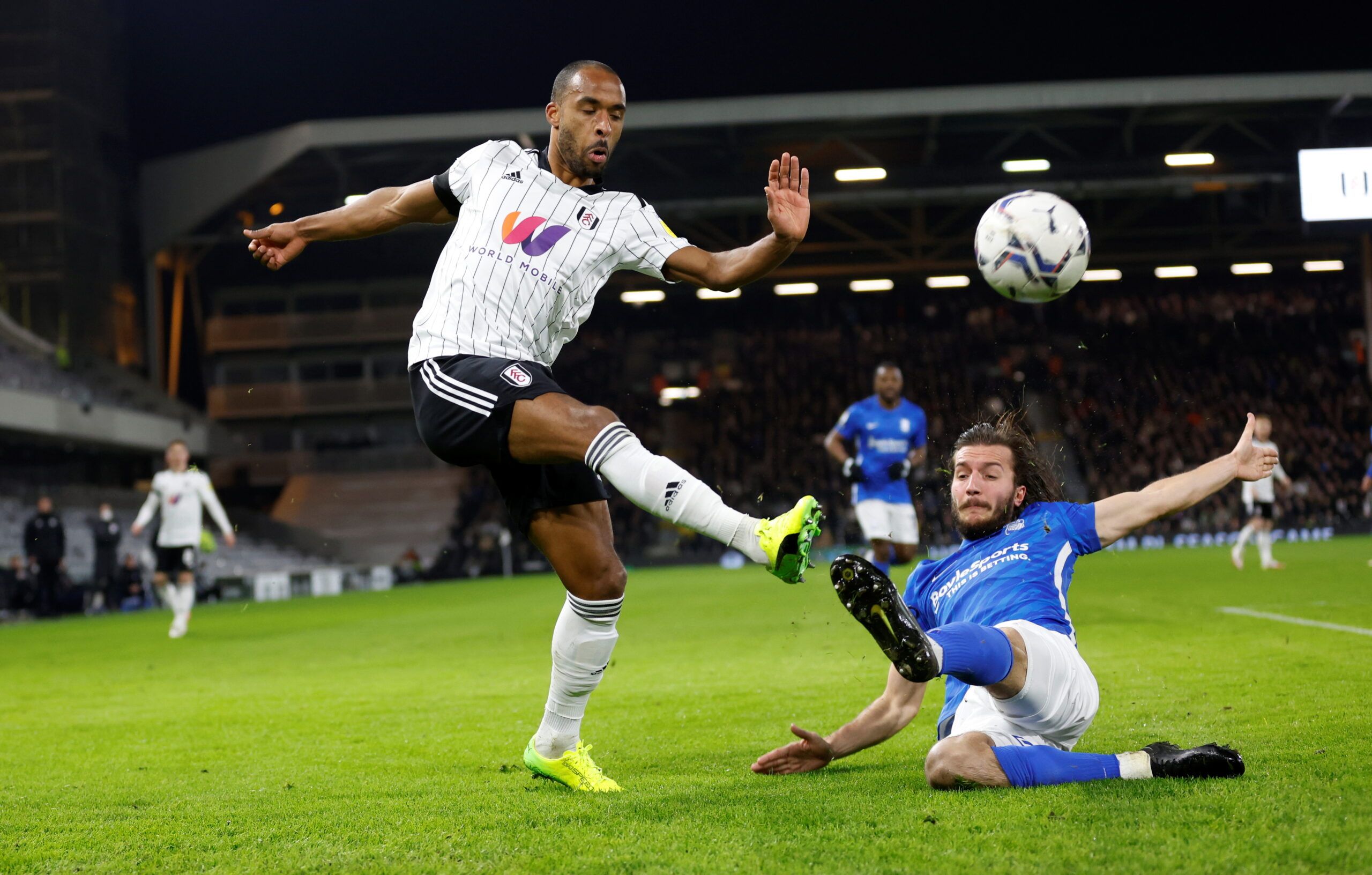 Soccer Football - Championship - Fulham v Birmingham City - Craven Cottage, London, Britain - January 18, 2022 Fulham?s Denis Odoi in action with Birmingham City?s Ivan Sunjic Peter Cziborra/Action Images  EDITORIAL USE ONLY. No use with unauthorized audio, video, data, fixture lists, club/league logos or 