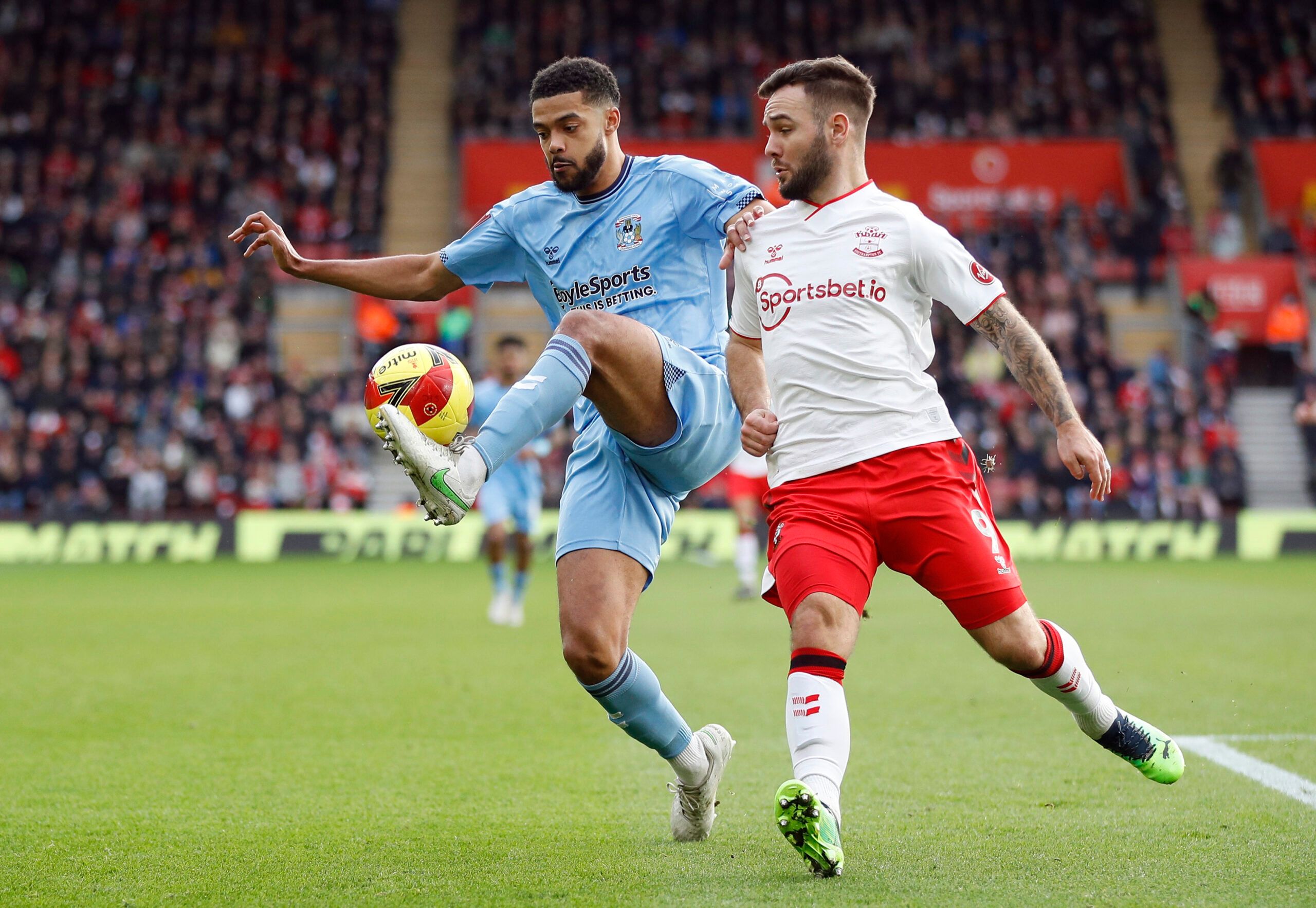 Soccer Football - FA Cup - Fourth Round - Southampton v Coventry City - St Mary's Stadium, Southampton, Britain - February 5, 2022 Coventry City's Jake Clark-Salter in action with Southampton's Adam Armstrong REUTERS/Peter Nicholls