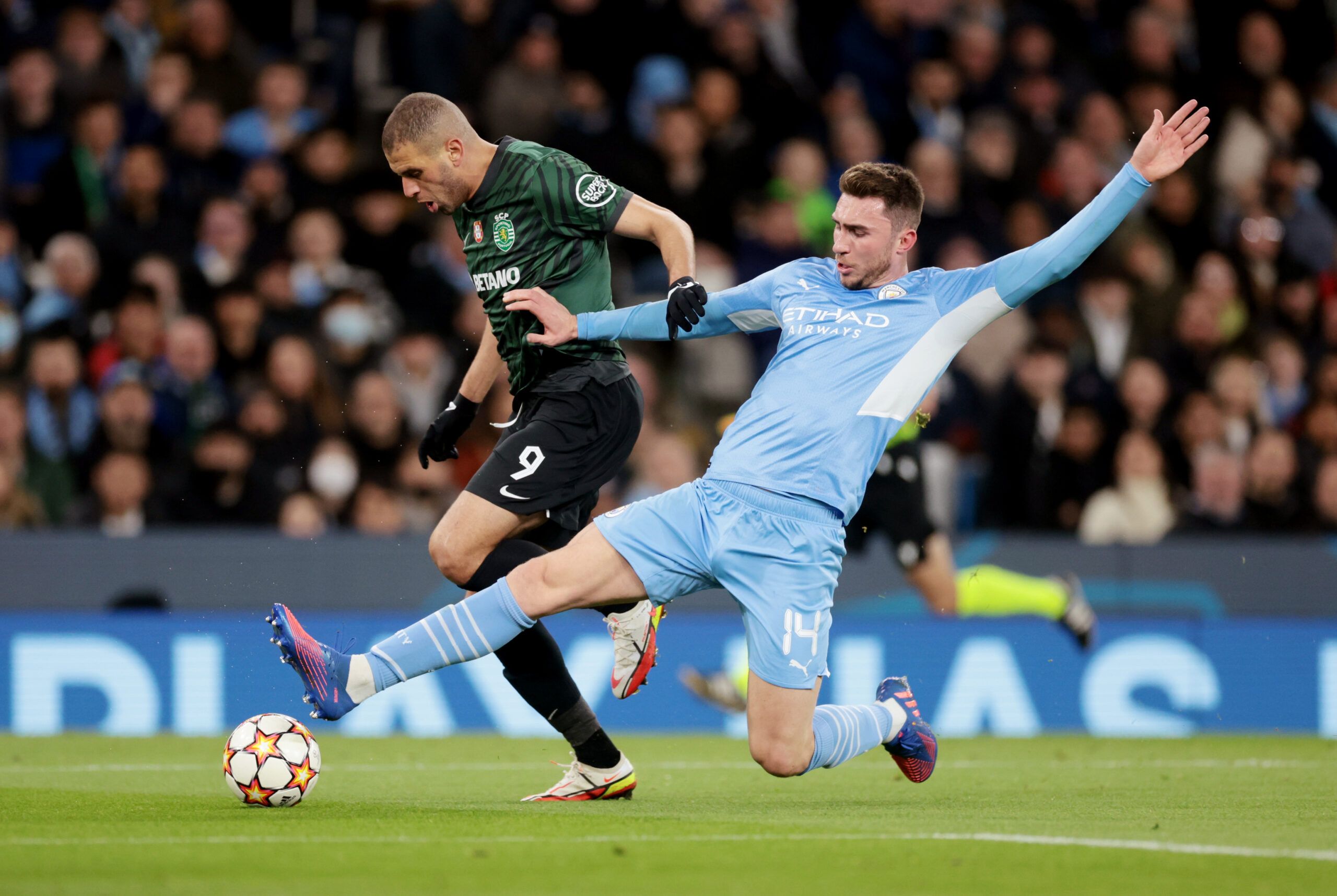 Soccer Football - Champions League - Round of 16 Second Leg - Manchester City v Sporting CP - Etihad Stadium, Manchester, Britain - March 9, 2022 Sporting CP's Islam Slimani in action with Manchester City's Aymeric Laporte Action Images via Reuters/Lee Smith