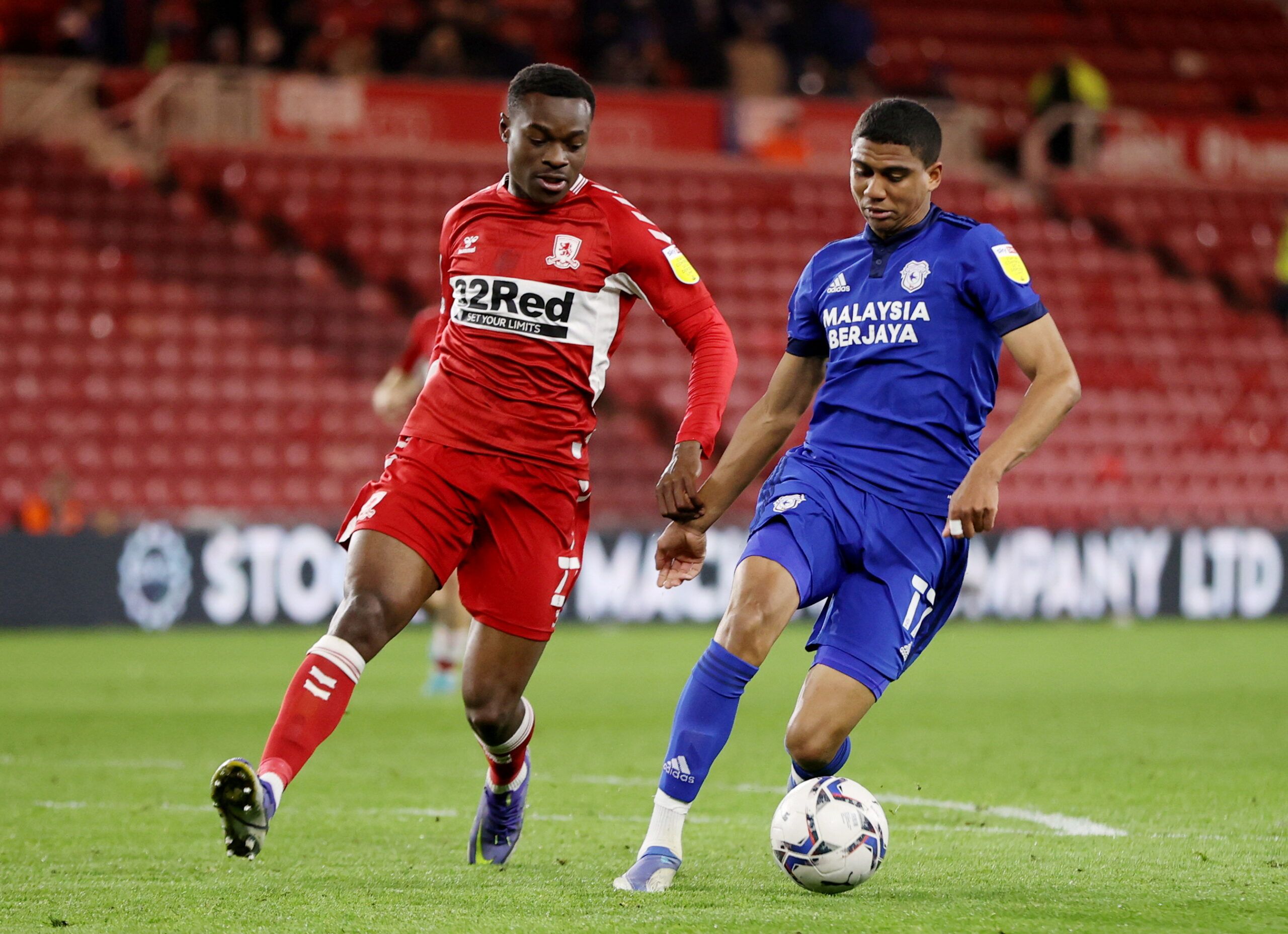 Soccer Football - Championship - Middlesbrough v Cardiff City - Riverside Stadium, Middlesbrough, Britain - April 27, 2022  Middlesbrough's Marc Bola in action with Cardiff City's Cody Drameh   Action Images/Molly Darlington    EDITORIAL USE ONLY. No use with unauthorized audio, video, data, fixture lists, club/league logos or 