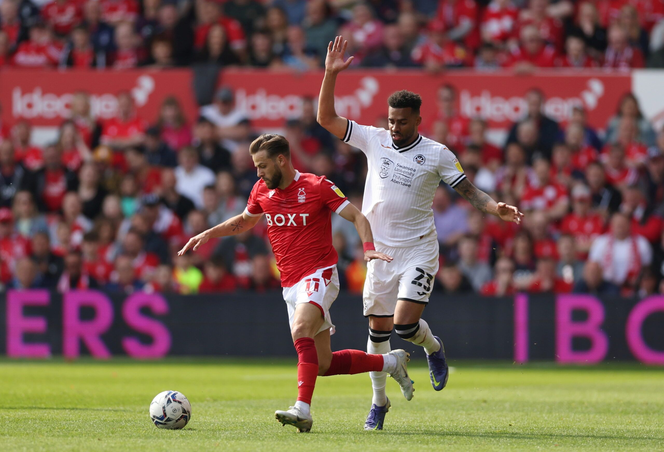 Soccer Football - Championship - Nottingham Forest v Swansea City - The City Ground, Nottingham, Britain - April 30, 2022 Nottingham Forest's Philip Zinckernagel in action with Swansea City's Cyrus Christie Action Images/Matthew Childs  EDITORIAL USE ONLY. No use with unauthorized audio, video, data, fixture lists, club/league logos or 