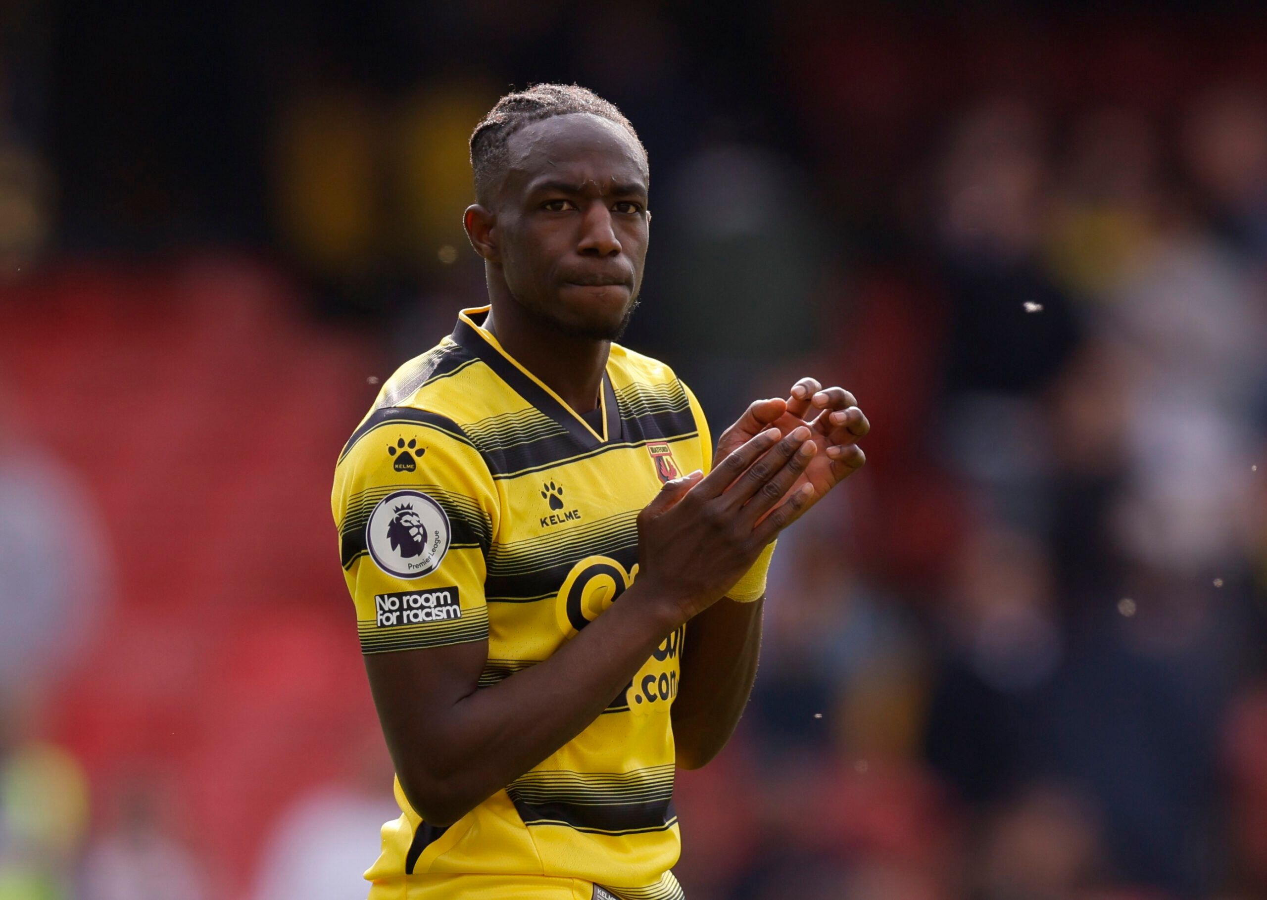 Soccer Football - Premier League - Watford v Burnley - Vicarage Road, Watford, Britain - April 30, 2022 Watford's Hassane Kamara looks dejected as he applauds the fans after the match Action Images via Reuters/Andrew Couldridge EDITORIAL USE ONLY. No use with unauthorized audio, video, data, fixture lists, club/league logos or 'live' services. Online in-match use limited to 75 images, no video emulation. No use in betting, games or single club /league/player publications.  Please contact your ac