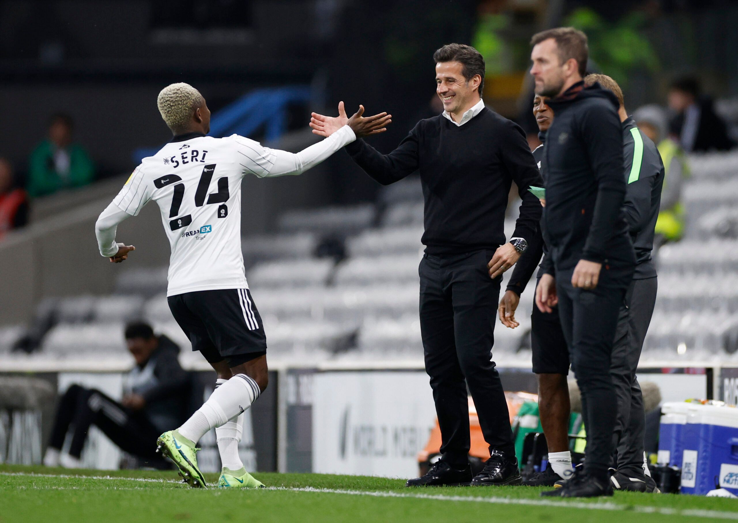 Soccer Football - Championship - Fulham v Luton Town - Craven Cottage, London, Britain- May 2, 2022 Fulham's Jean Michael Seri celebrates scoring their sixth goal with Fulham manager Marco Silva Action Images/John Sibley EDITORIAL USE ONLY. No use with unauthorized audio, video, data, fixture lists, club/league logos or 'live' services. Online in-match use limited to 75 images, no video emulation. No use in betting, games or single club /league/player publications.  Please contact your account r