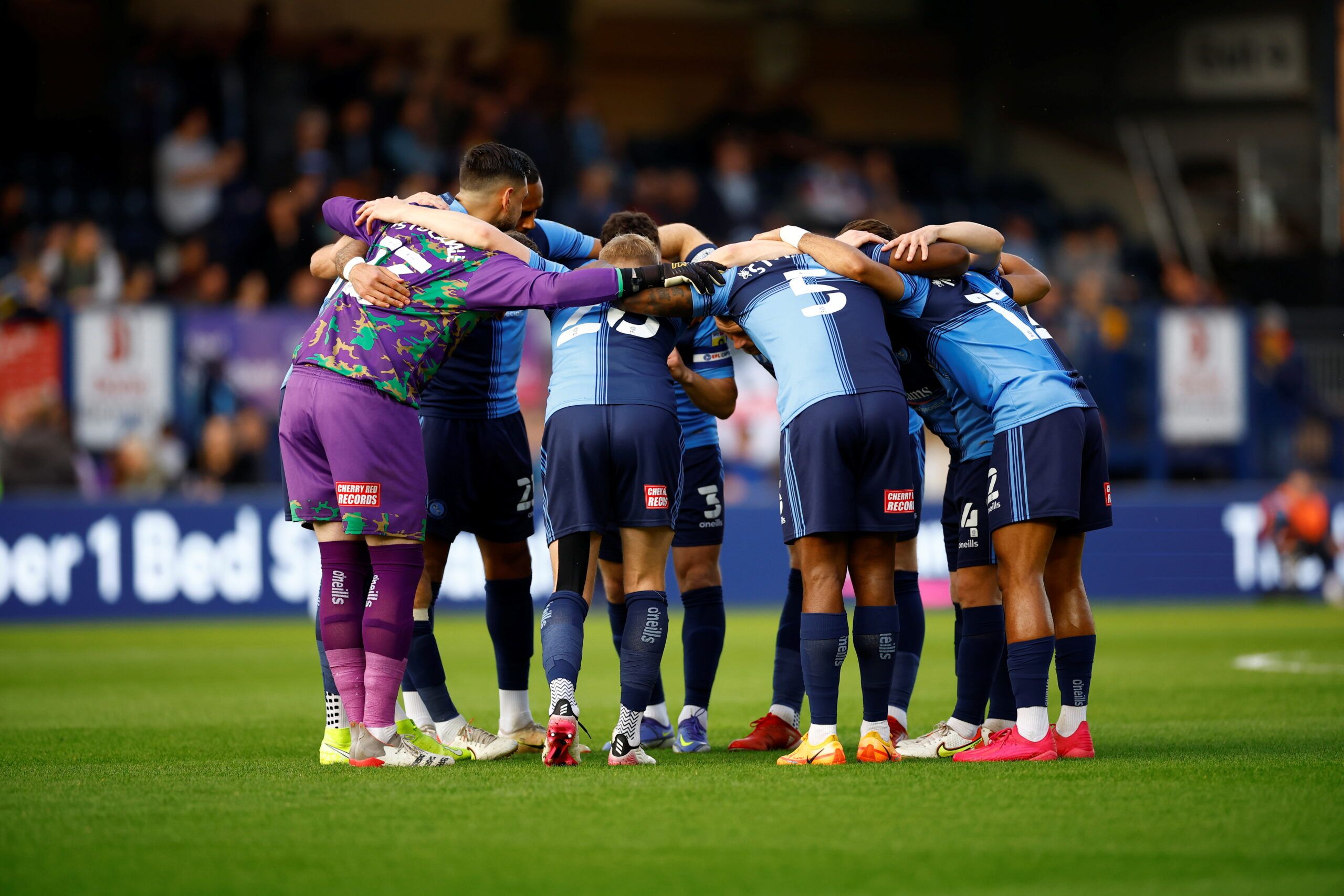 Soccer Football - League One - Play-Off Semi Final - First Leg - Wycombe Wanderers v Milton Keynes Dons - Adams Park, High Wycombe, Britain - May 5, 2022 Wycombe Wanderers' team huddle before the match Action Images/Andrew Boyers  EDITORIAL USE ONLY. No use with unauthorized audio, video, data, fixture lists, club/league logos or 