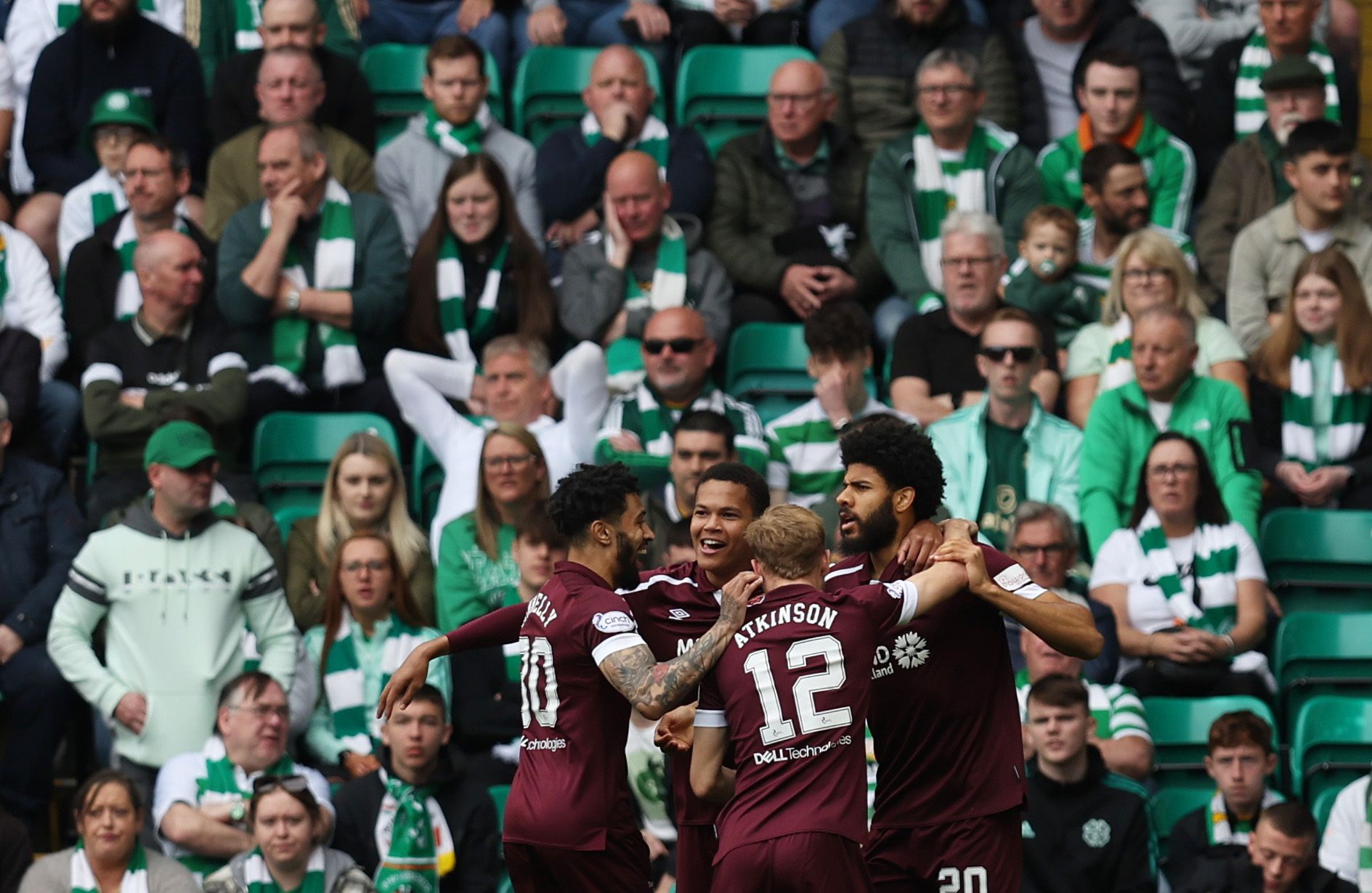 Soccer Football - Scottish Premiership - Celtic v Heart of Midlothian - Celtic Park, Glasgow, Scotland, Britain - May 7, 2022 Hearts' Ellis Simms celebrates scoring their first goal with teammates REUTERS/Russell Cheyne