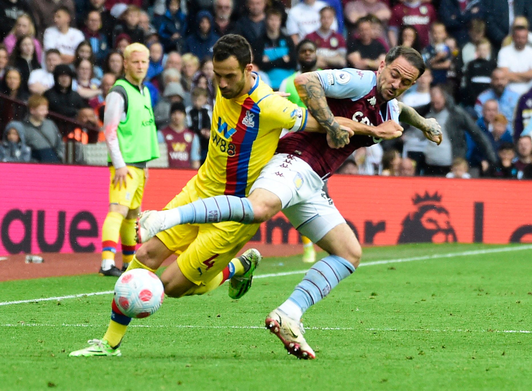 Soccer Football - Premier League - Aston Villa v Crystal Palace - Villa Park, Birmingham, Britain - May 15, 2022 Crystal Palace's Luka Milivojevic in action with Aston Villa's Danny Ings REUTERS/Rebecca Naden EDITORIAL USE ONLY. No use with unauthorized audio, video, data, fixture lists, club/league logos or 'live' services. Online in-match use limited to 75 images, no video emulation. No use in betting, games or single club /league/player publications.  Please contact your account representativ
