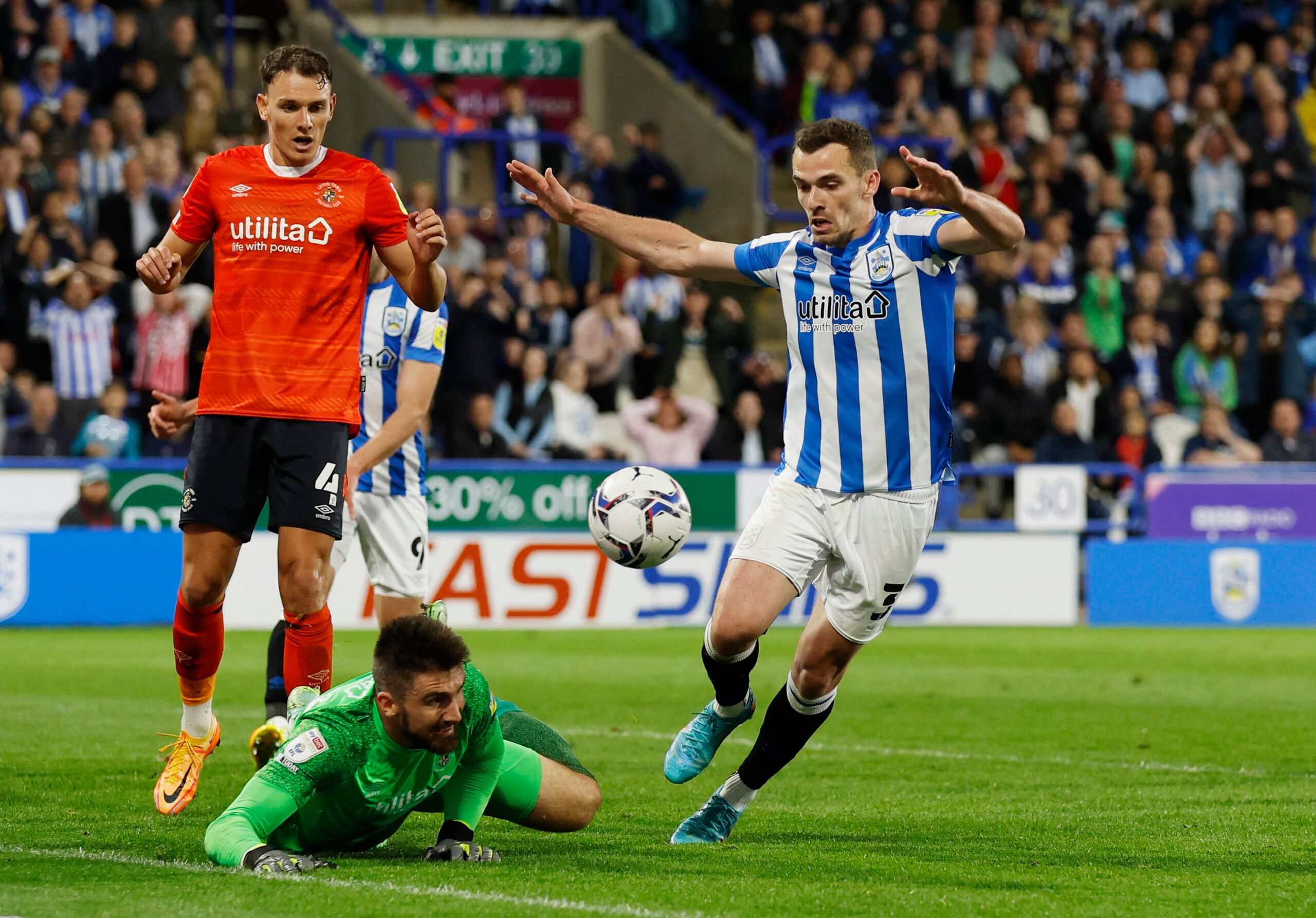 Soccer Football - Championship - Play-Offs Second Leg - Huddersfield Town v Luton Town - John Smith's Stadium, Huddersfield, Britain - May 16, 2022 Luton Town's Matt Ingram in action with Huddersfield Town's Harry Toffolo Action Images via Reuters/Jason Cairnduff