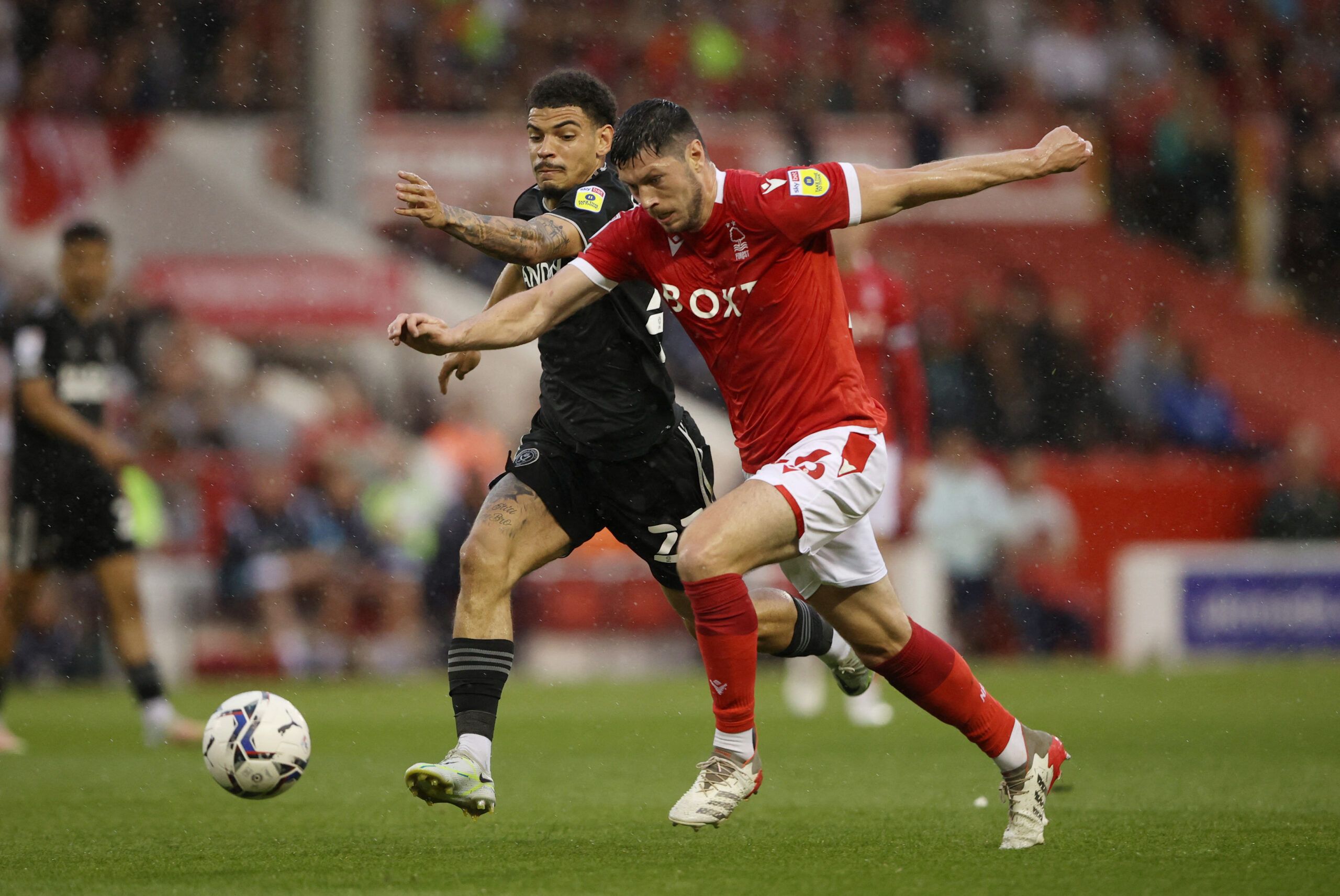 Soccer Football - Championship - Play-Offs Second Leg - Nottingham Forest v Sheffield United - The City Ground, Nottingham, Britain - May 17, 2022 Sheffield United's Morgan Gibbs-White in action with Nottingham Forest's Scott McKenna Action Images via Reuters/Molly Darlington