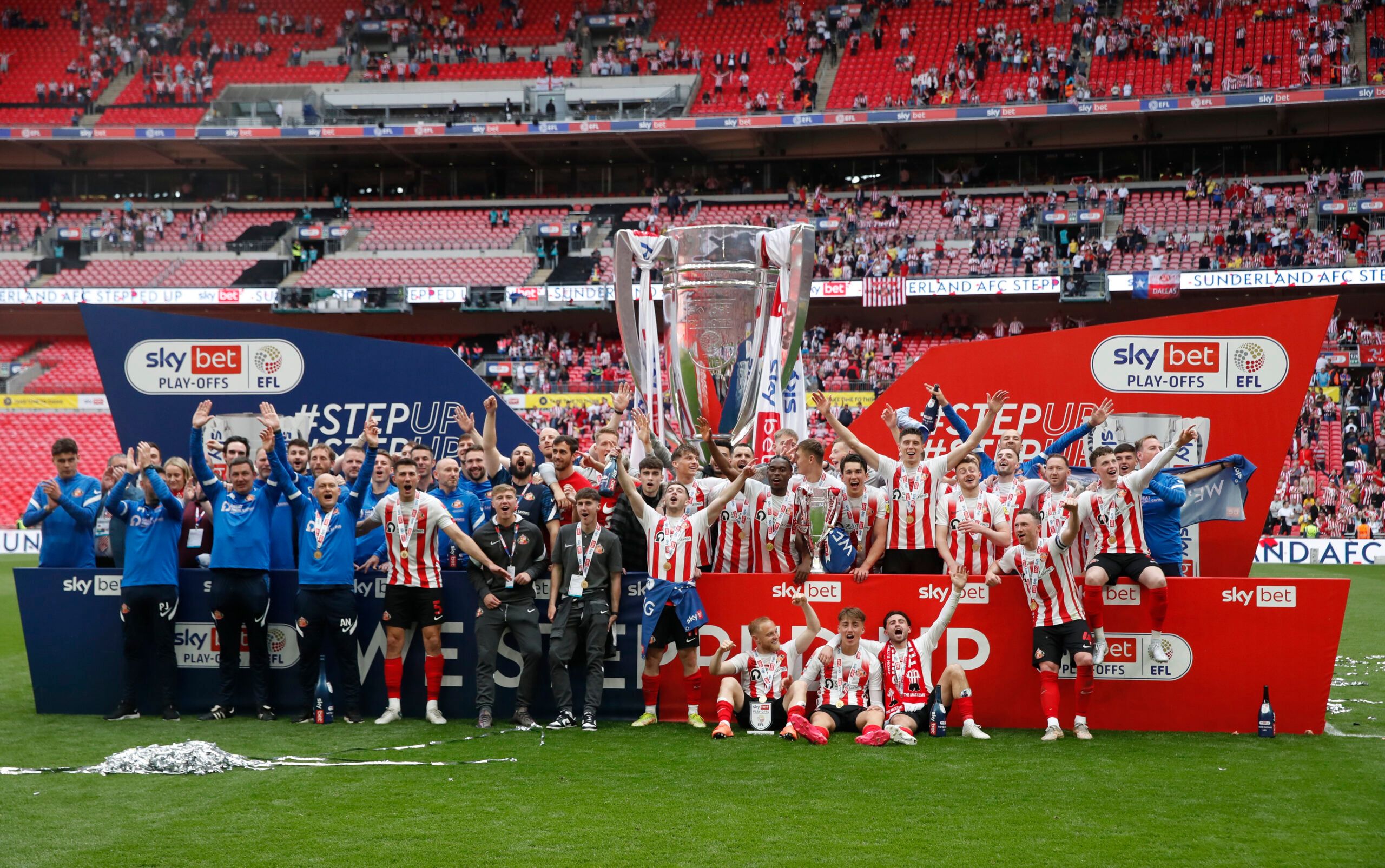 Soccer Football - League One Play-Off Final - Sunderland v Wycombe Wanderers - Wembley Stadium, London, Britain - May 21, 2022  Sunderland players and coaches celebrate with the trophy after winning the League One Play-Off Action Images/Matthew Childs EDITORIAL USE ONLY. No use with unauthorized audio, video, data, fixture lists, club/league logos or 'live' services. Online in-match use limited to 75 images, no video emulation. No use in betting, games or single club /league/player publications.