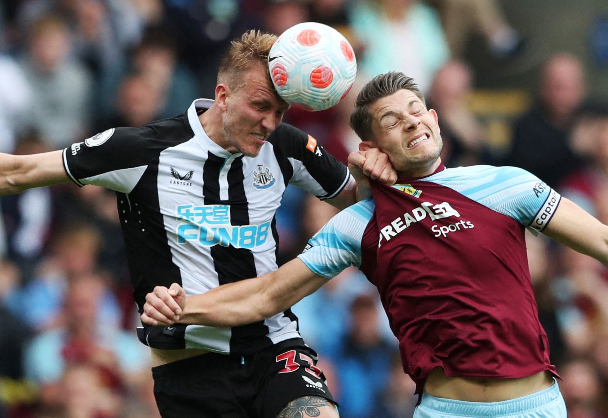 Soccer Football - Premier League - Burnley v Newcastle United - Turf Moor, Burnley, Britain - May 22, 2022 Newcastle United's Dan Burn in action with Burnley's James Tarkowski REUTERS/Scott Heppell EDITORIAL USE ONLY. No use with unauthorized audio, video, data, fixture lists, club/league logos or 'live' services. Online in-match use limited to 75 images, no video emulation. No use in betting, games or single club /league/player publications.  Please contact your account representative for furth