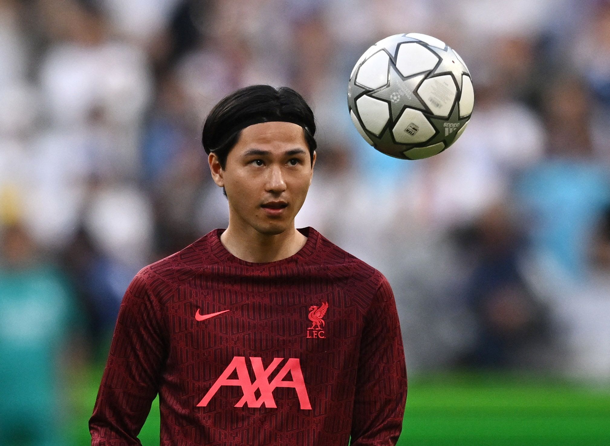 Soccer Football - Champions League Final - Liverpool v Real Madrid - Stade de France, Saint-Denis near Paris, France - May 28, 2022 Liverpool's Takumi Minamino during the warm up before the match REUTERS/Dylan Martinez
