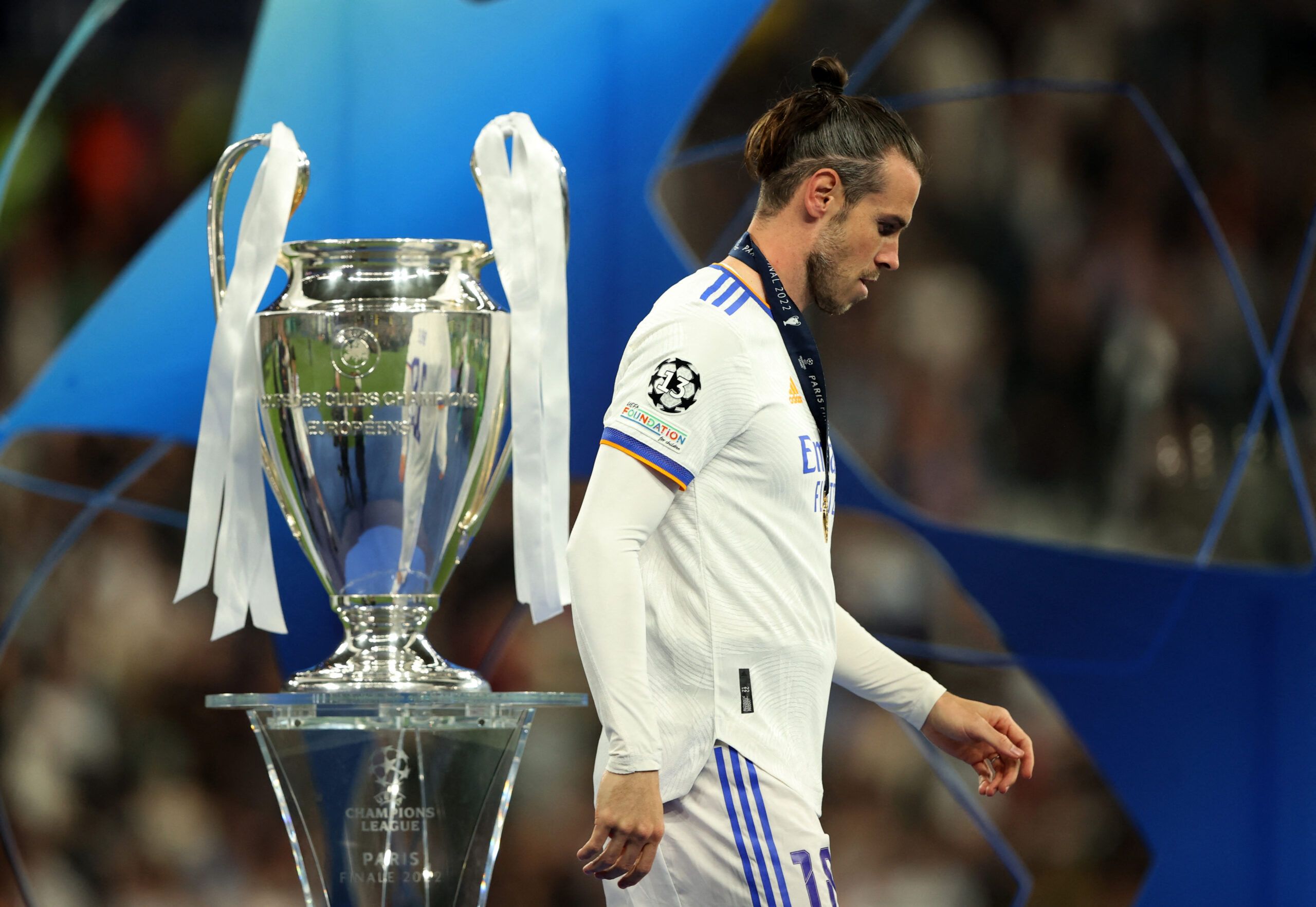 Soccer Football - Champions League Final - Liverpool v Real Madrid - Stade de France, Saint-Denis near Paris, France - May 28, 2022 Real Madrid's Gareth Bale walks past the champions league trophy before the presentation REUTERS/Molly Darlington