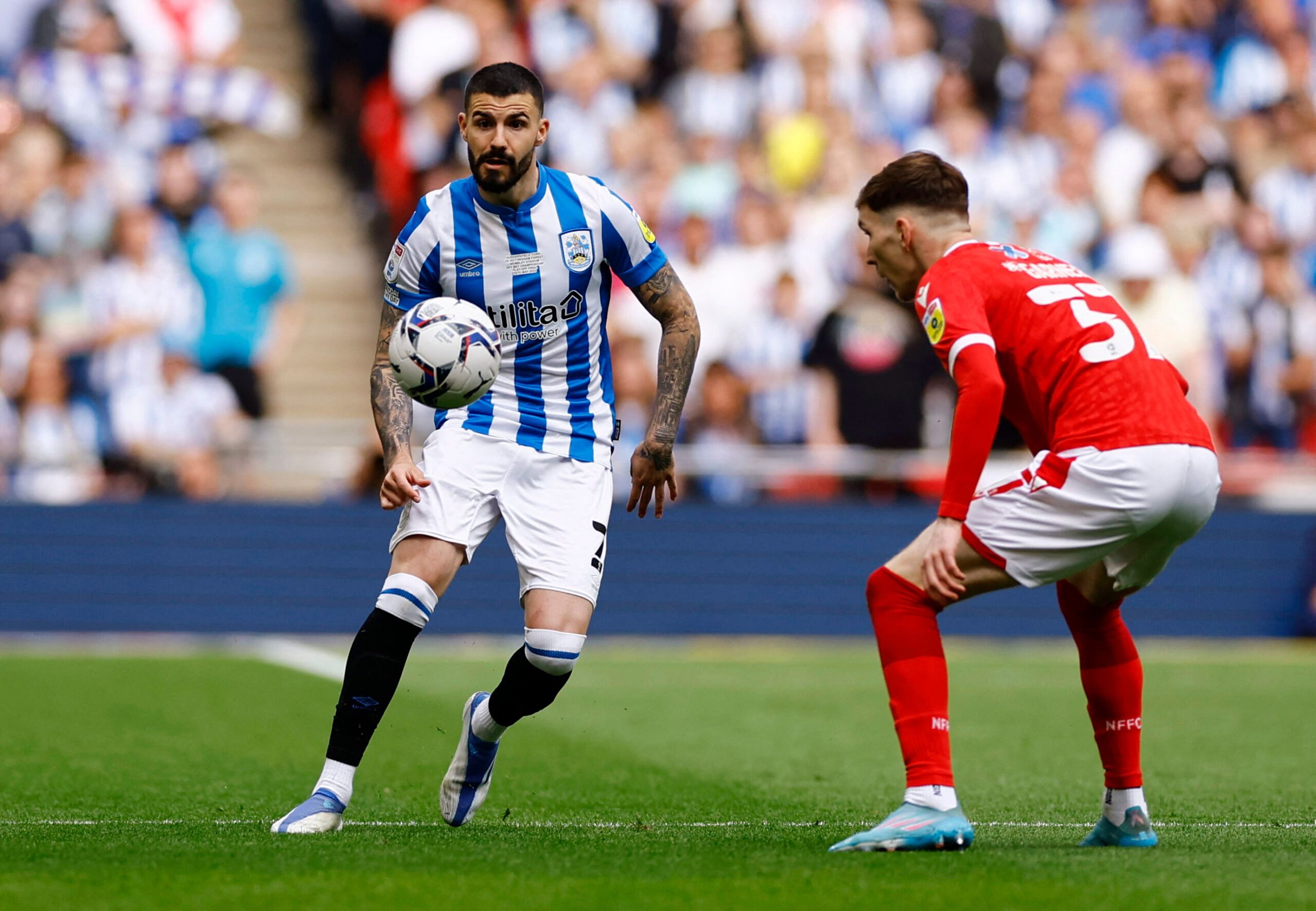 Soccer Football - Championship Play-Off Final - Huddersfield Town v Nottingham Forest - Wembley Stadium, London, Britain - May 29, 2022 Huddersfield Town's Pipa in action with Nottingham Forest's James Garner Action Images via Reuters/Andrew Boyers