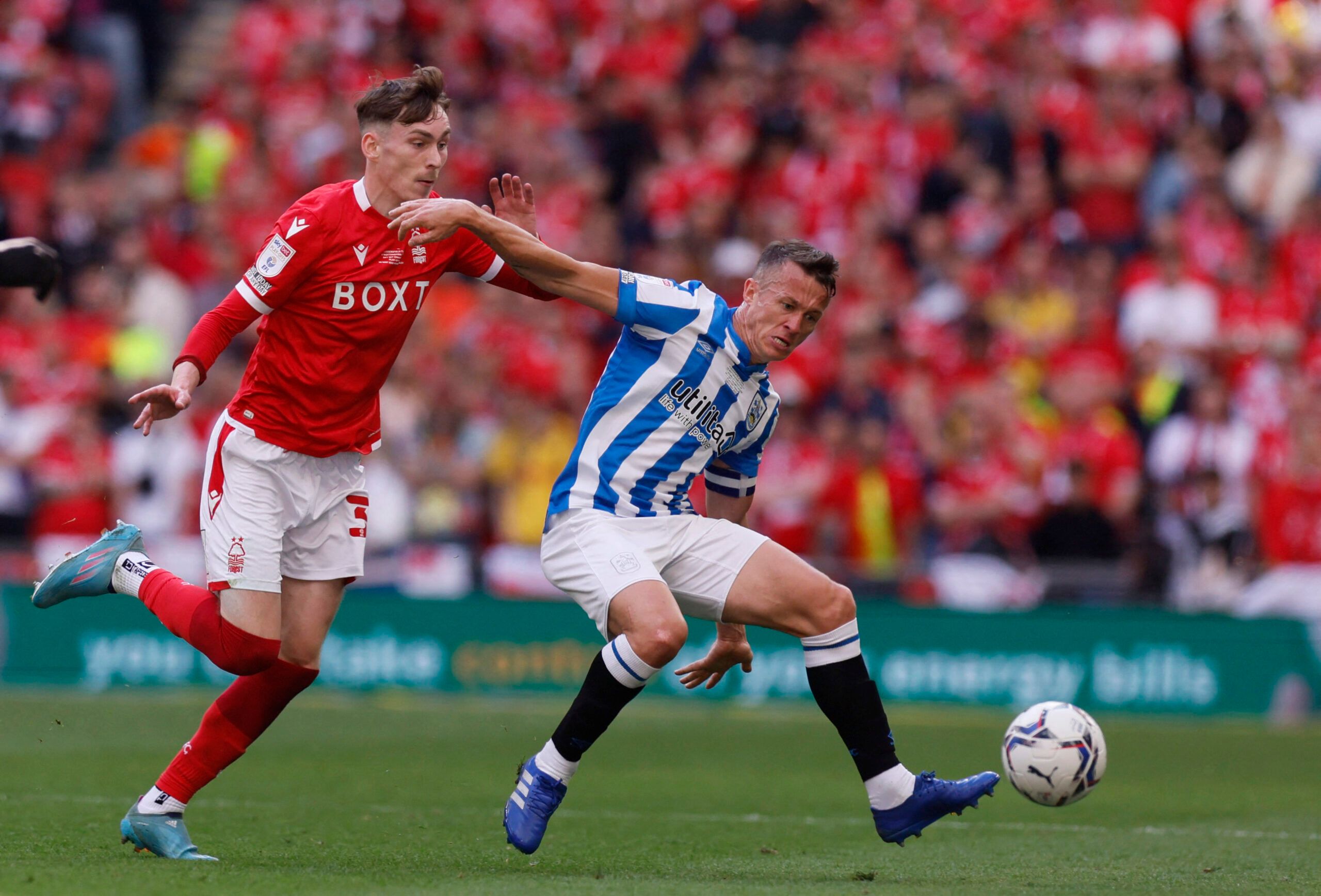 Soccer Football - Championship Play-Off Final - Huddersfield Town v Nottingham Forest - Wembley Stadium, London, Britain - May 29, 2022 Nottingham Forest's James Garner in action with Huddersfield Town's Jonathan Hogg Action Images via Reuters/Andrew Couldridge