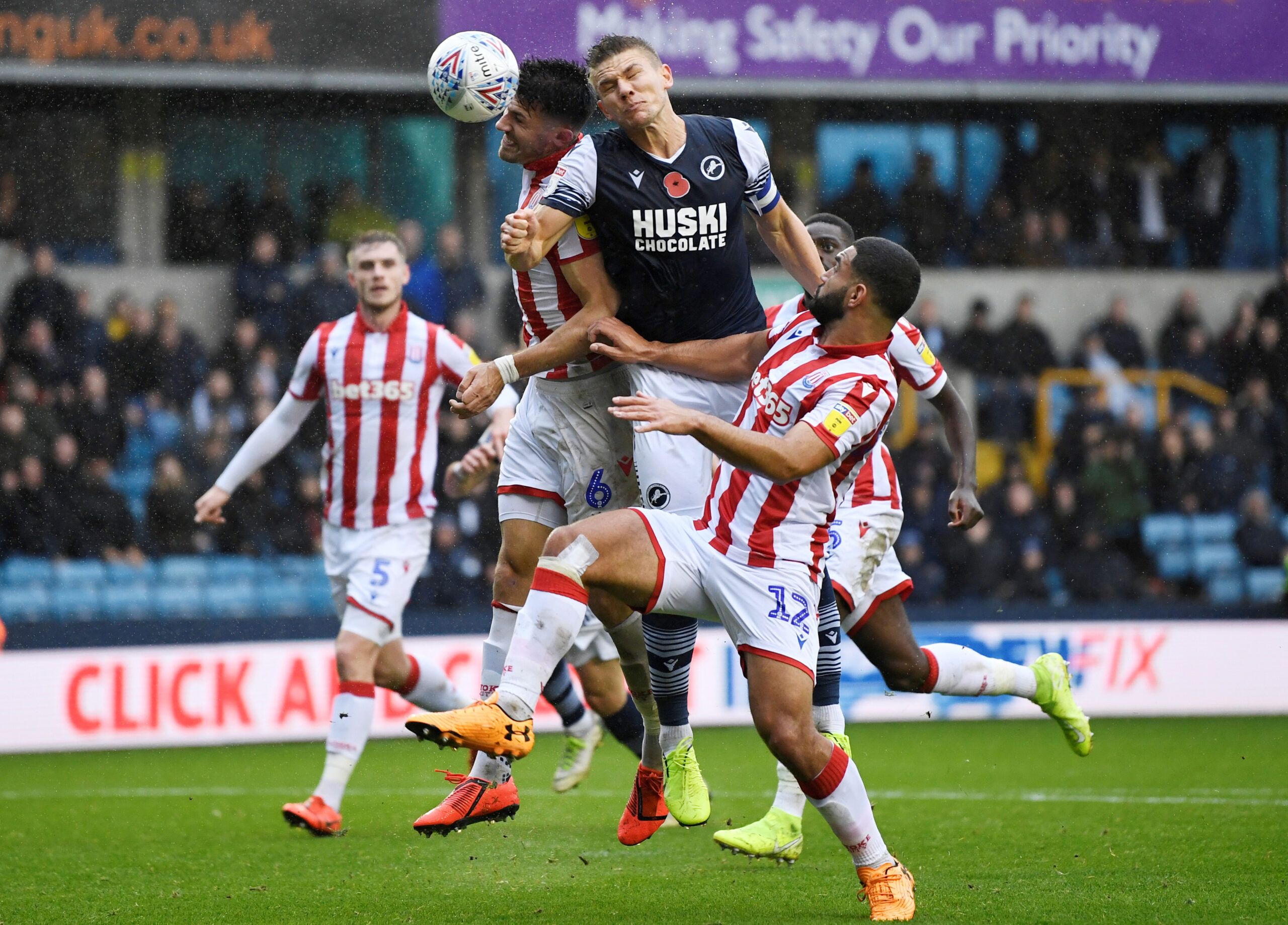 Soccer Football - Championship - Millwall v Stoke City - The Den, London, Britain - October 26, 2019  Millwall's Shaun Hutchunson in action with Stoke City’s Danny Batth  Action Images/Tony O'Brien  EDITORIAL USE ONLY. No use with unauthorized audio, video, data, fixture lists, club/league logos or 