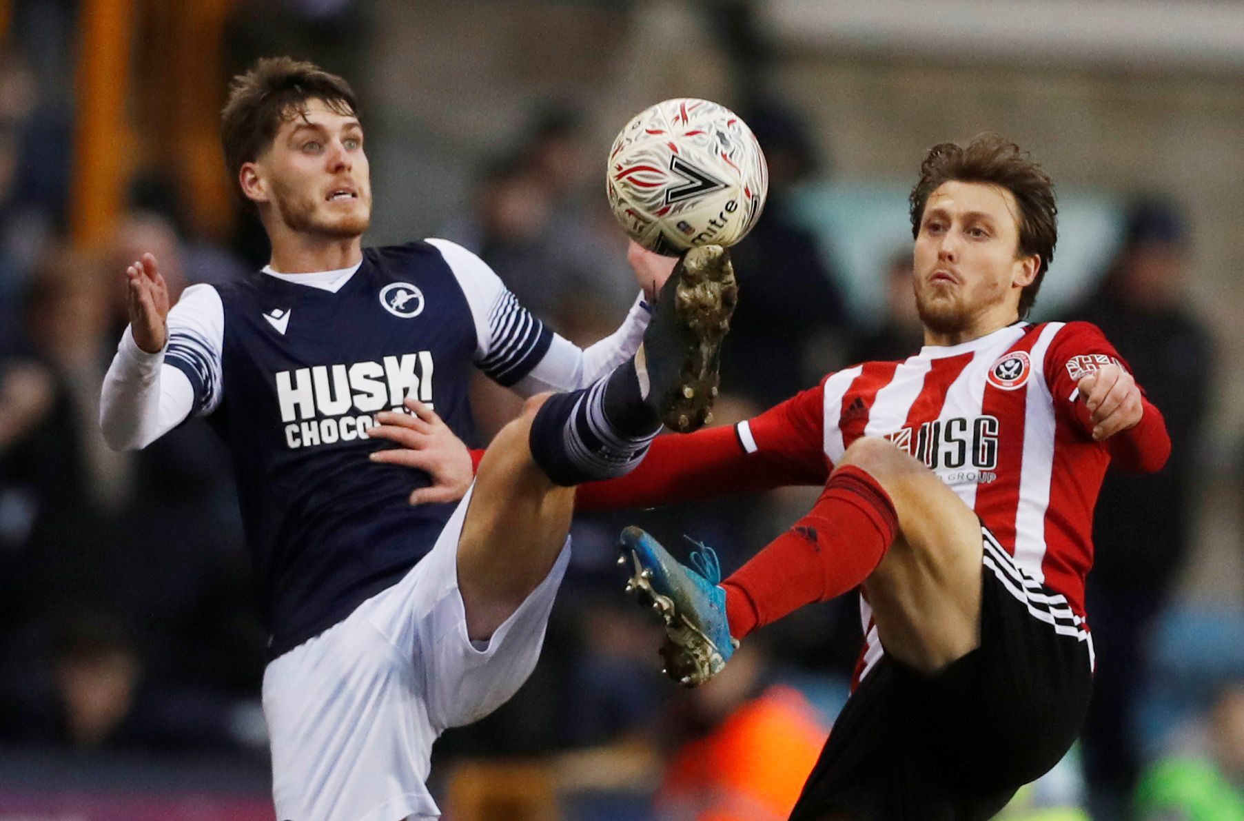 Soccer Football - FA Cup Fourth Round - Millwall v Sheffield United - The Den, London, Britain - January 25, 2020  Millwall's Connor Mahoney in action with Sheffield United's Luke Freeman    Action Images via Reuters/Matthew Childs