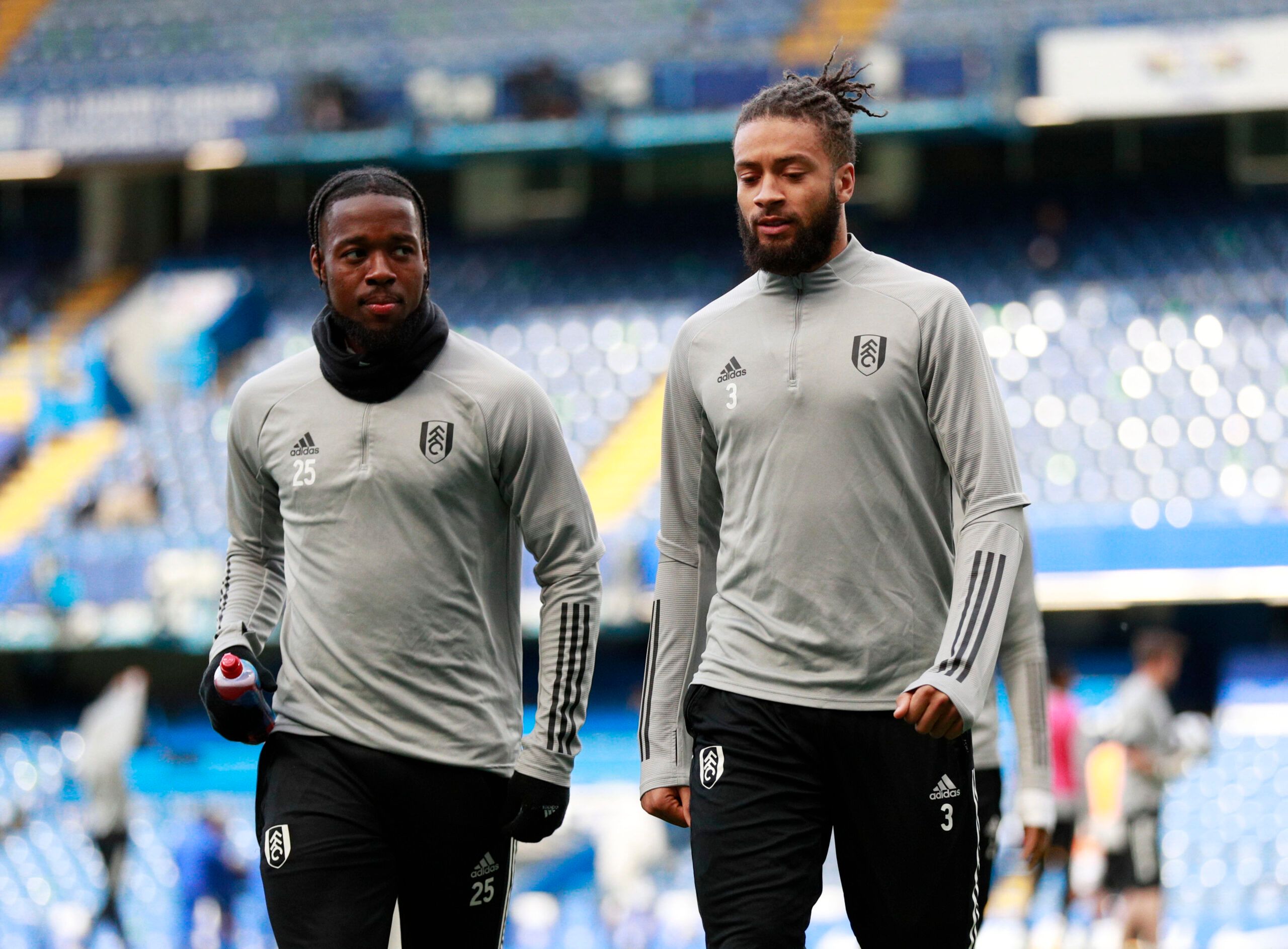 Soccer Football - Premier League - Chelsea v Fulham - Stamford Bridge, London, Britain - May 1, 2021 Fulham's Josh Onomah and Michael Hector during the warm up before the match Pool via REUTERS/Ian Walton EDITORIAL USE ONLY. No use with unauthorized audio, video, data, fixture lists, club/league logos or 'live' services. Online in-match use limited to 75 images, no video emulation. No use in betting, games or single club /league/player publications.  Please contact your account representative fo