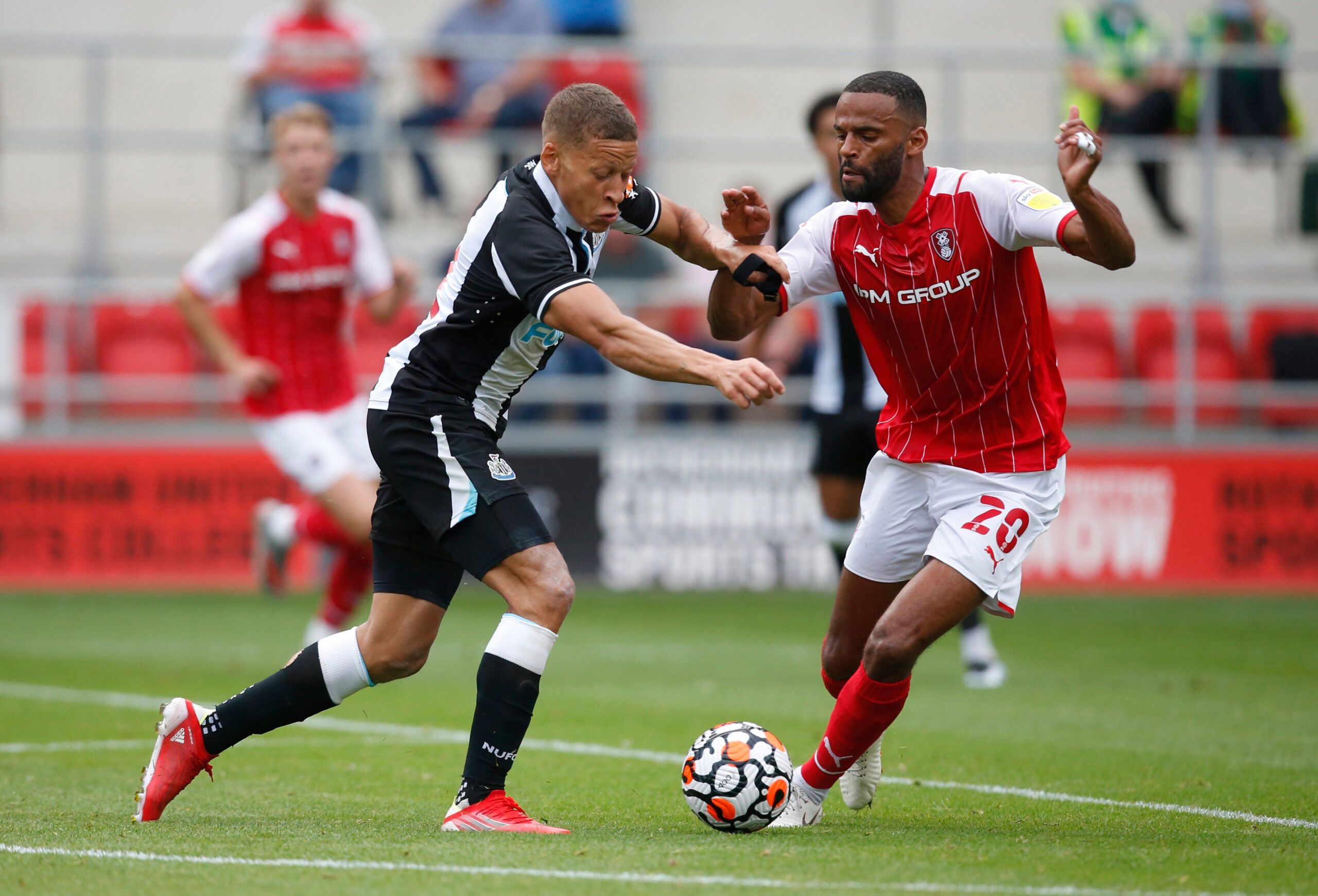 Soccer Football - Pre Season Friendly - Rotherham United v Newcastle United - AESSEAL New York Stadium, Rotherham, Britain - July 27, 2021 Newcastle United's Dwight Gayle in action with Rotherham United's Michael Ihiekwe Action Images via Reuters/Ed Sykes