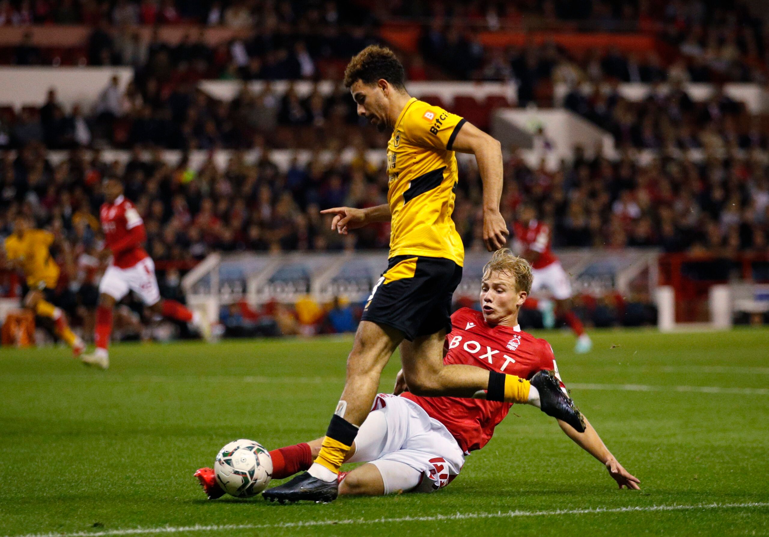 Soccer - England - Carabao Cup Second Round - Nottingham Forest v Wolverhampton Wanderers - The City Ground, Nottingham, Britain - August 24, 2021 Nottingham Forest's Finley Back in action with Wolverhampton Wanderers' Morgan Gibbs-White Action Images via Reuters/Andrew Boyers
