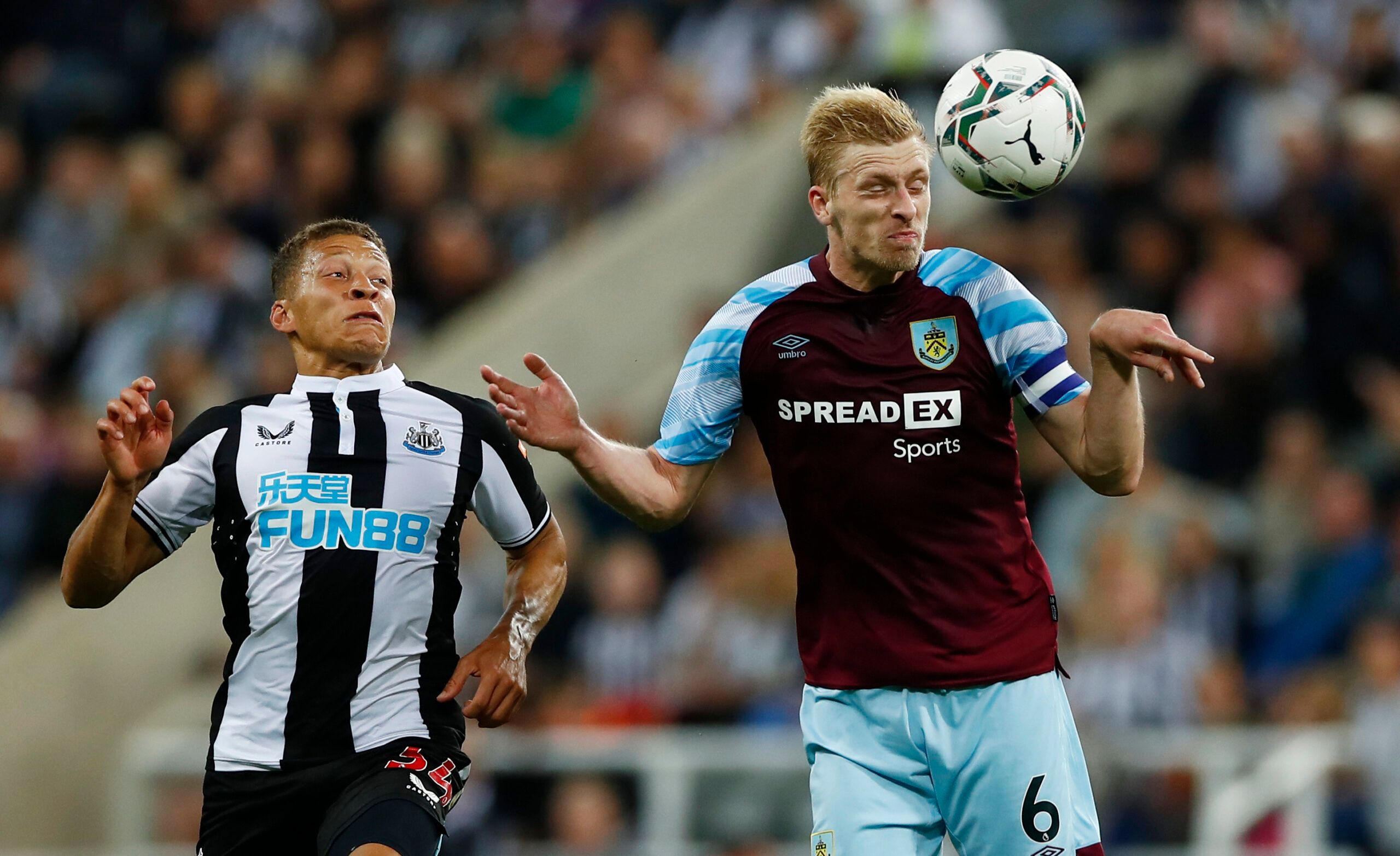 Soccer Football - Carabao Cup - Second Round - Newcastle United v Burnley - St James' Park, Newcastle, Britain - August 25, 2021 Newcastle United's Dwight Gayle in action with Burnley's Ben Mee Action Images via Reuters/Jason Cairnduff EDITORIAL USE ONLY. No use with unauthorized audio, video, data, fixture lists, club/league logos or 'live' services. Online in-match use limited to 75 images, no video emulation. No use in betting, games or single club /league/player publications.  Please contact