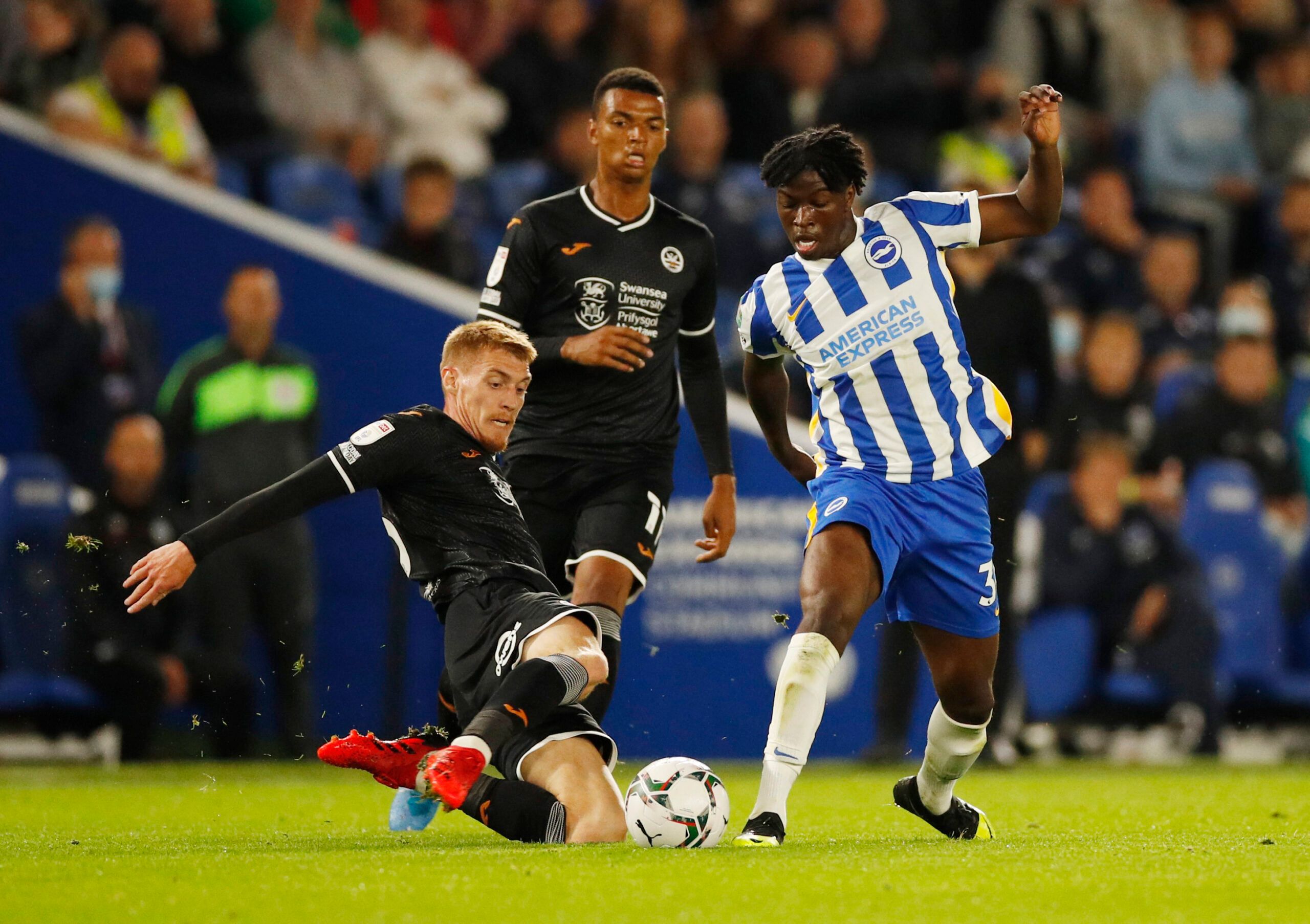 Soccer Football - Carabao Cup - Third Round - Brighton &amp; Hove Albion v Swansea City - The American Express Community Stadium, Brighton, Britain - September 22, 2021 Swansea City's Jay Fulton in action with Brighton &amp; Hove Albion's Taylor Richards Action Images via Reuters/Andrew Boyers EDITORIAL USE ONLY. No use with unauthorized audio, video, data, fixture lists, club/league logos or 'live' services. Online in-match use limited to 75 images, no video emulation. No use in betting, games 