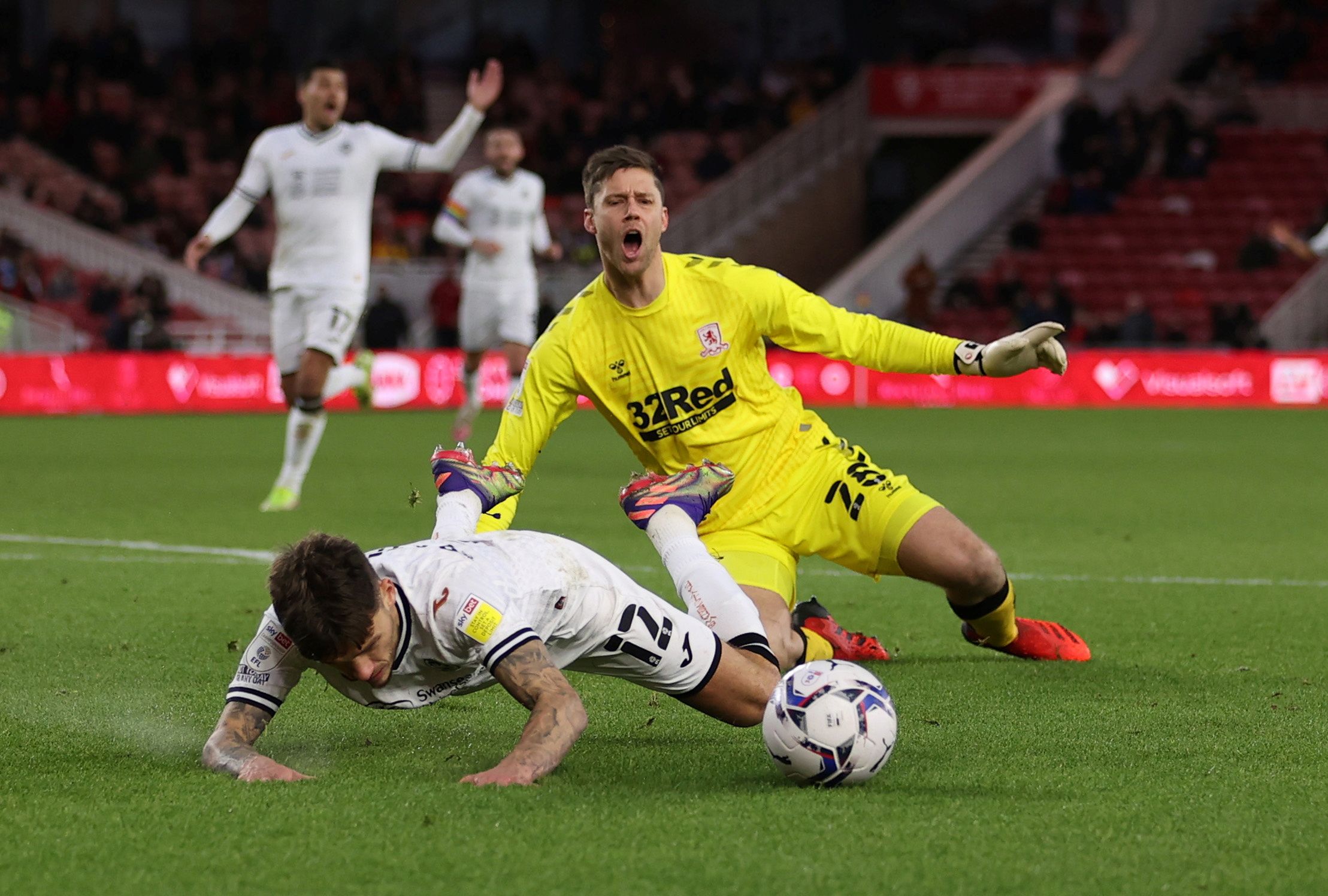 Soccer Football - Middlesbrough v Swansea City - Riverside Stadium, Middlesbrough, Britain - December 4, 2021  Middlesbrough's Luke Daniels in action with Swansea City's Jamie Paterson   Action Images/John Clifton  EDITORIAL USE ONLY. No use with unauthorized audio, video, data, fixture lists, club/league logos or 