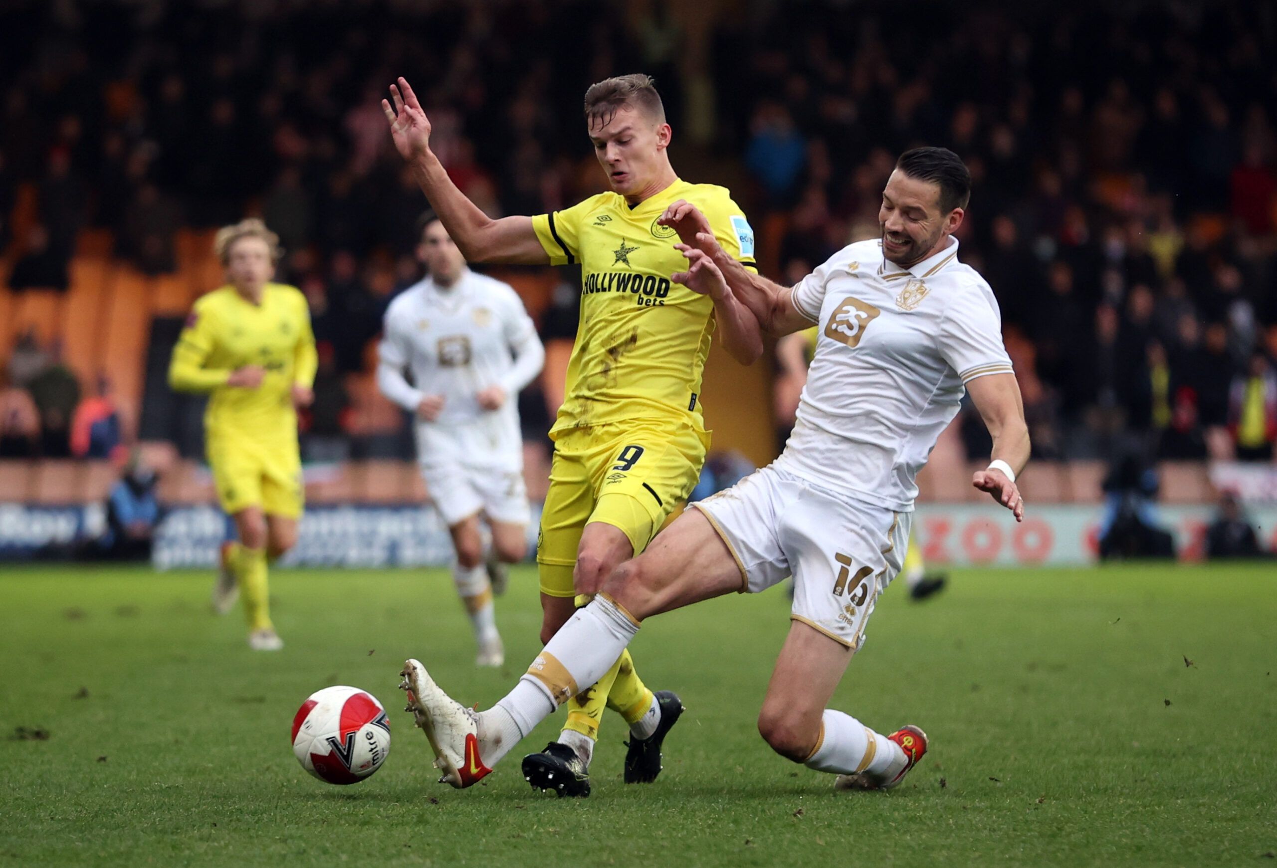 Soccer Football - FA Cup Third Round - Port Vale v Brentford - Vale Park, Stoke-on-Trent, Britain - January 8, 2022  Brentford's Marcus Forss in action with Port Vale's Aaron Martin Action Images via Reuters/Molly Darlington