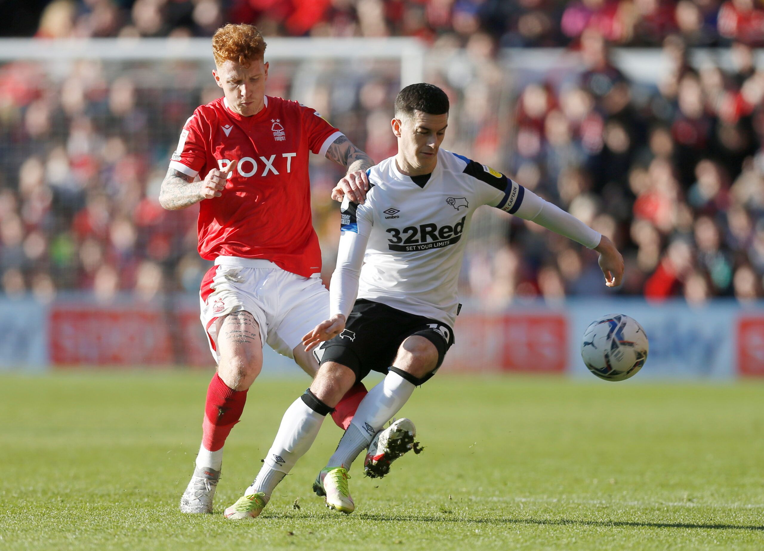 Soccer Football - Championship - Nottingham Forest v Derby County - The City Ground, Nottingham, Britain - January 22, 2022 Nottingham Forest's Jack Colback in action with Derby County's Tom Lawrence  Action Images/Ed Sykes  EDITORIAL USE ONLY. No use with unauthorized audio, video, data, fixture lists, club/league logos or 