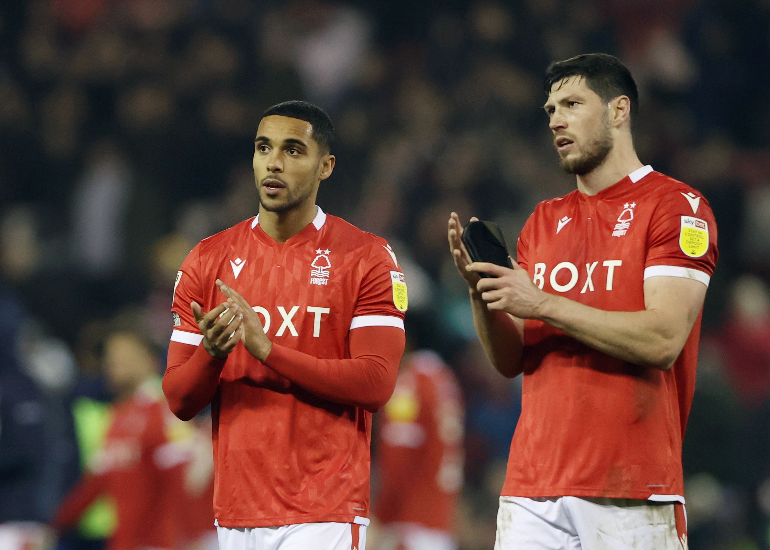 Soccer Football - Championship -  Nottingham Forest v Barnsley - City Ground, Nottingham, Britain - January 25, 2022 Nottingham Forest's Max Lowe and Scott McKenna after the match   Action Images/Molly Darlington  EDITORIAL USE ONLY. No use with unauthorized audio, video, data, fixture lists, club/league logos or 