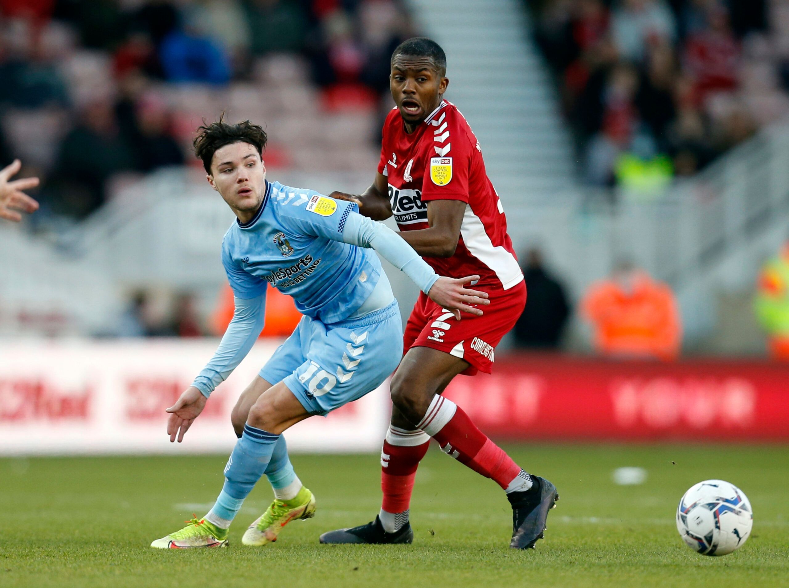 Soccer Football - Championship - Middlesbrough v Coventry City - Riverside Stadium, Middlesbrough, Britain - January 29, 2022 Middlesbrough's Anfernee Dijksteel in action with Coventry City's Callum O'Hare Action Images/Ed Sykes EDITORIAL USE ONLY. No use with unauthorized audio, video, data, fixture lists, club/league logos or 'live' services. Online in-match use limited to 75 images, no video emulation. No use in betting, games or single club /league/player publications.  Please contact your a
