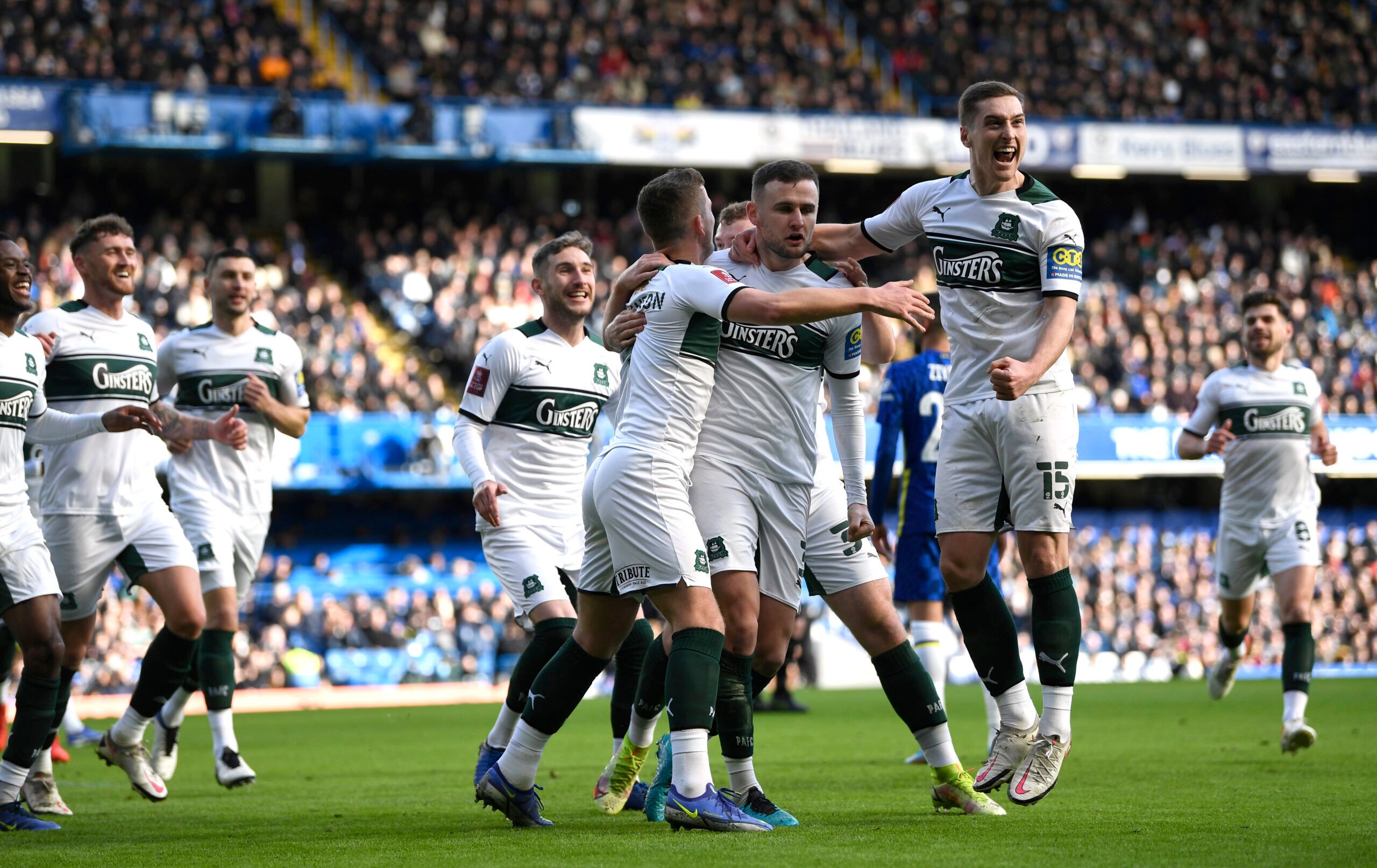 Soccer Football -  FA Cup - Fourth Round - Chelsea v Plymouth Argyle - Stamford Bridge, London, Britain - February 5, 2022 Plymouth Argyle's Macaulay Gillesphey celebrates scoring their first goal with teammates REUTERS/Tony Obrien