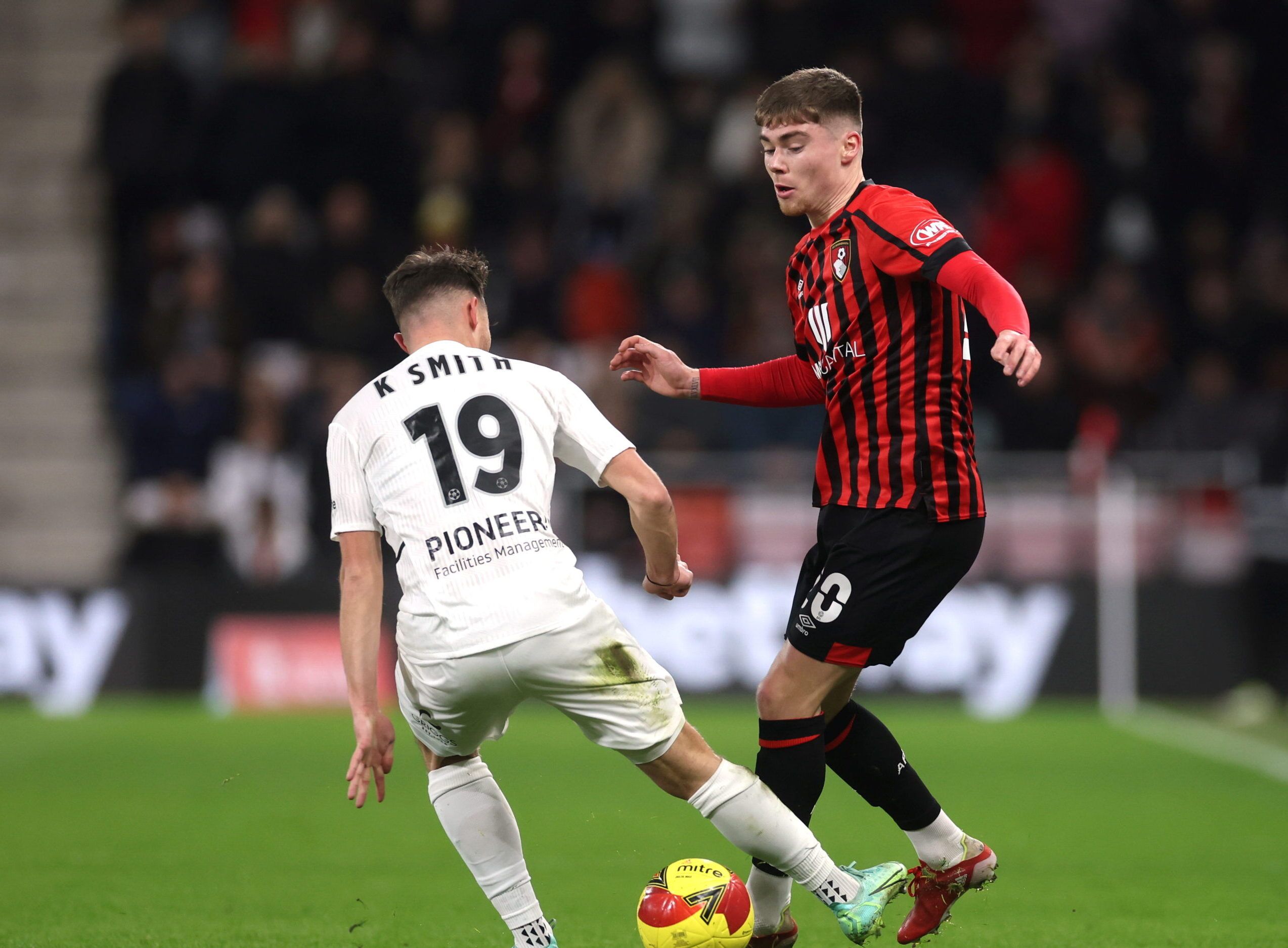 Soccer Football - FA Cup - Fourth Round - AFC Bournemouth v Boreham Wood - Vitality Stadium, Bournemouth, Britain - February 6, 2022 Boreham Wood's Kane Smith in action with Bournemouth's Leif Davis Action Images/Paul Childs
