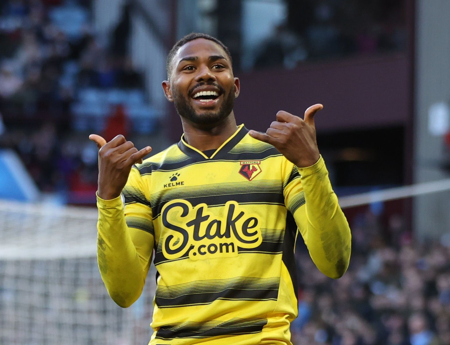 Soccer Football - Premier League - Aston Villa v Watford - Villa Park, Birmingham, Britain - February 19, 2022 Watford's Emmanuel Dennis celebrates scoring their first goal Action Images via Reuters/Molly Darlington EDITORIAL USE ONLY. No use with unauthorized audio, video, data, fixture lists, club/league logos or 'live' services. Online in-match use limited to 75 images, no video emulation. No use in betting, games or single club /league/player publications.  Please contact your account repres