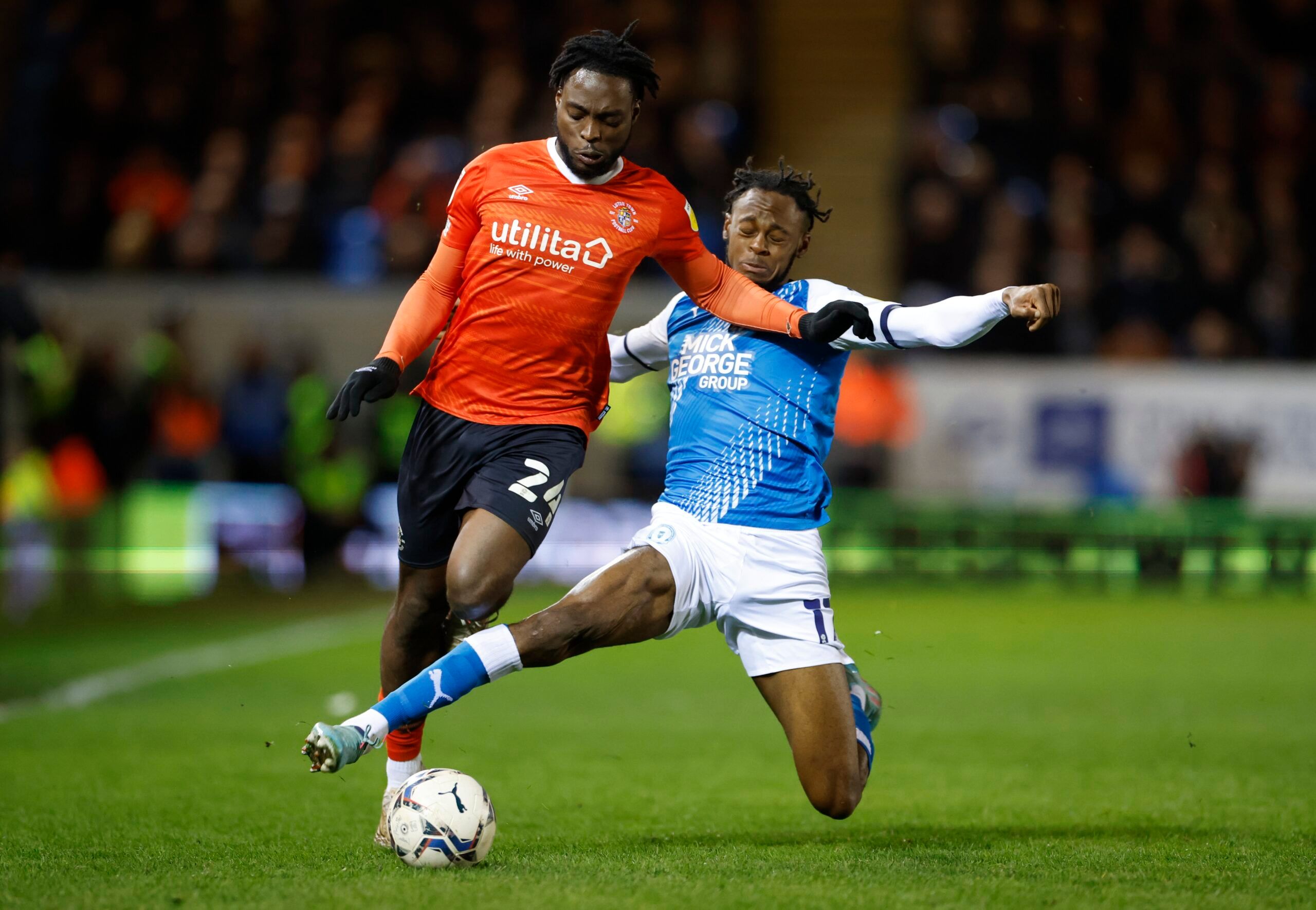 Soccer Football - Championship - Peterborough United v Luton Town - Weston Homes Stadium, Peterborough, Britain - April 5, 2022 Luton Town's Fred Onyedinma in action with Peterborough United's Ricky Jade-Jones Action Images/Peter Cziborra EDITORIAL USE ONLY. No use with unauthorized audio, video, data, fixture lists, club/league logos or 'live' services. Online in-match use limited to 75 images, no video emulation. No use in betting, games or single club /league/player publications.  Please cont