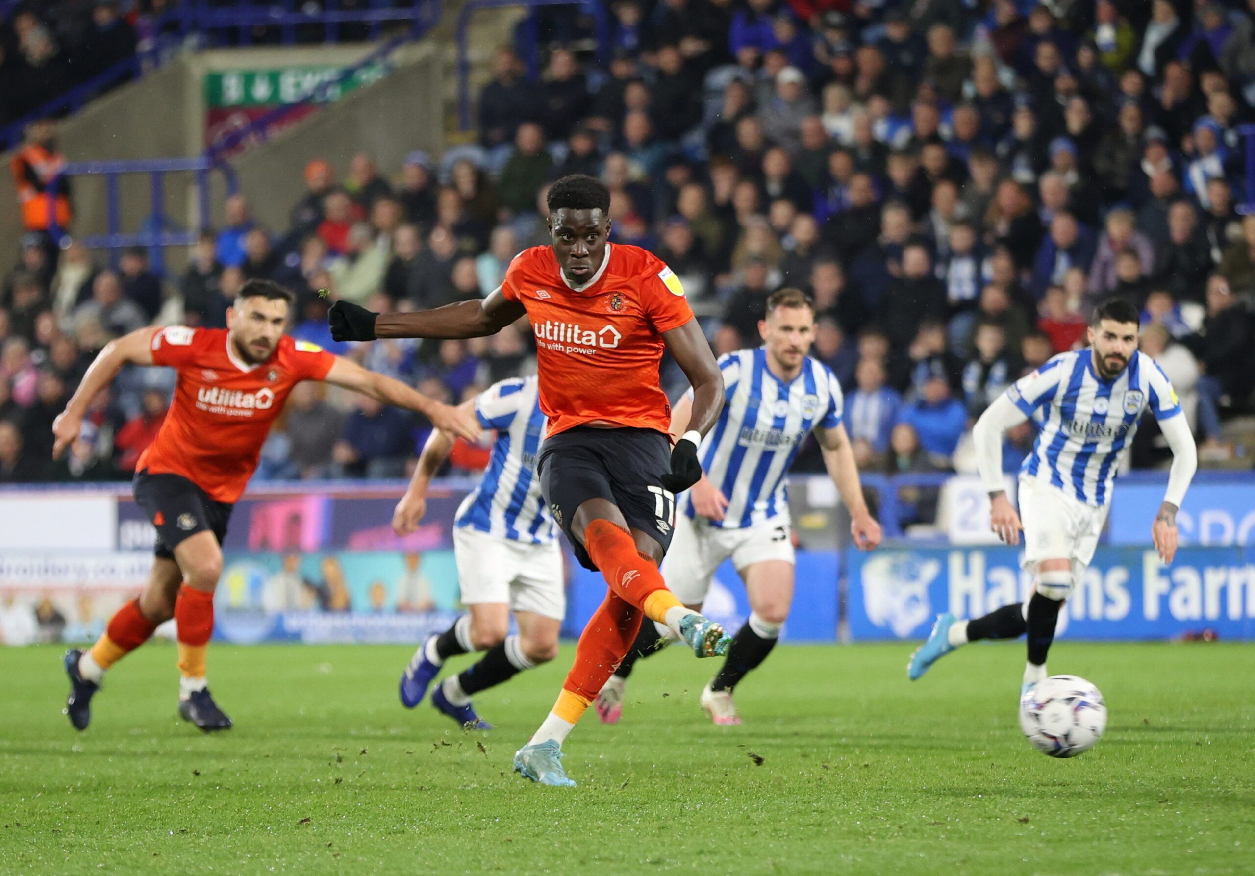 Soccer Football - Championship - Huddersfield Town v Luton Town - John Smith's Stadium, Huddersfield, Britain - April 11, 2022 Luton Town's Elijah Adebayo shoots at goal and misses from the penalty spot  Action Images/Molly Darlington  EDITORIAL USE ONLY. No use with unauthorized audio, video, data, fixture lists, club/league logos or 